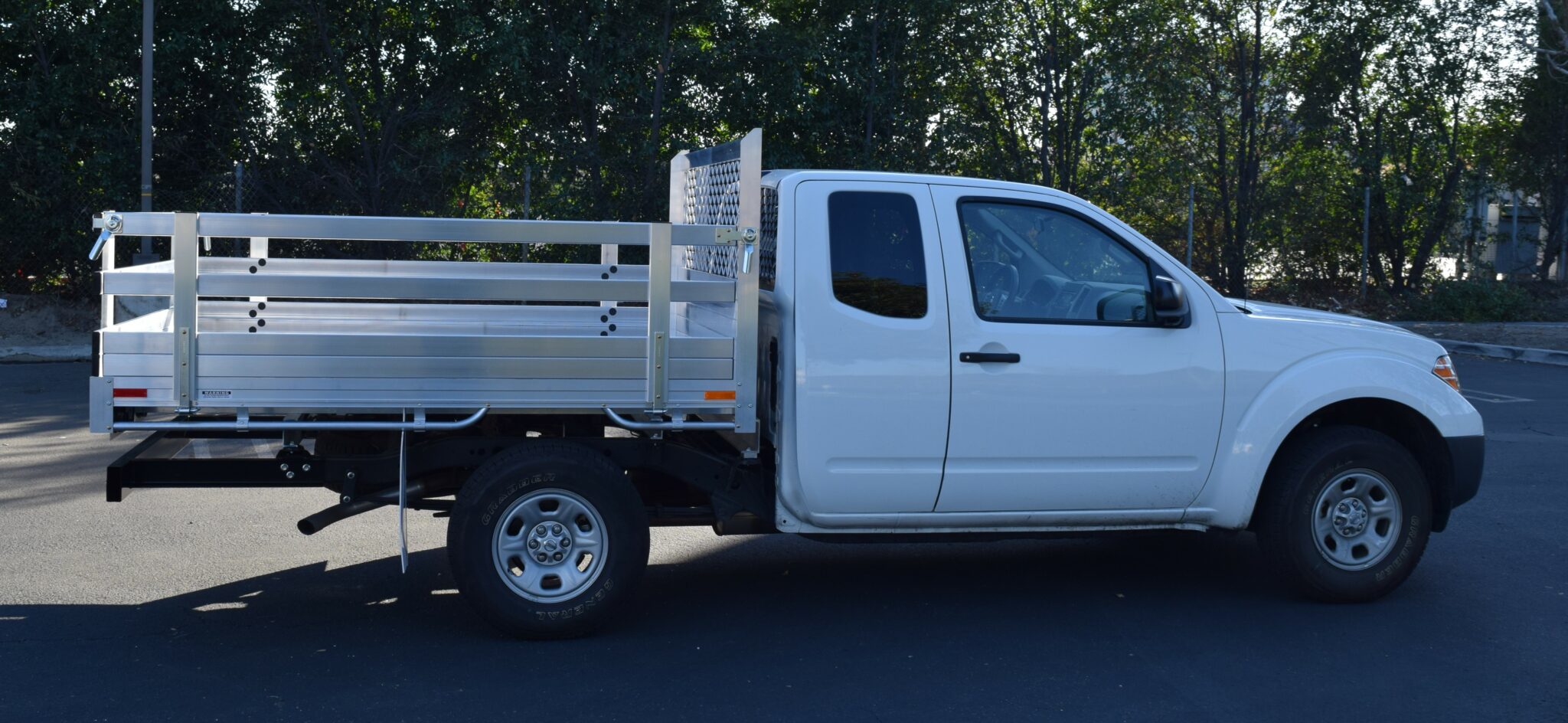 2017 Nissan Frontier 6'X7'6'', aluminum flatbed with 22'' fold down gates & dock bumper