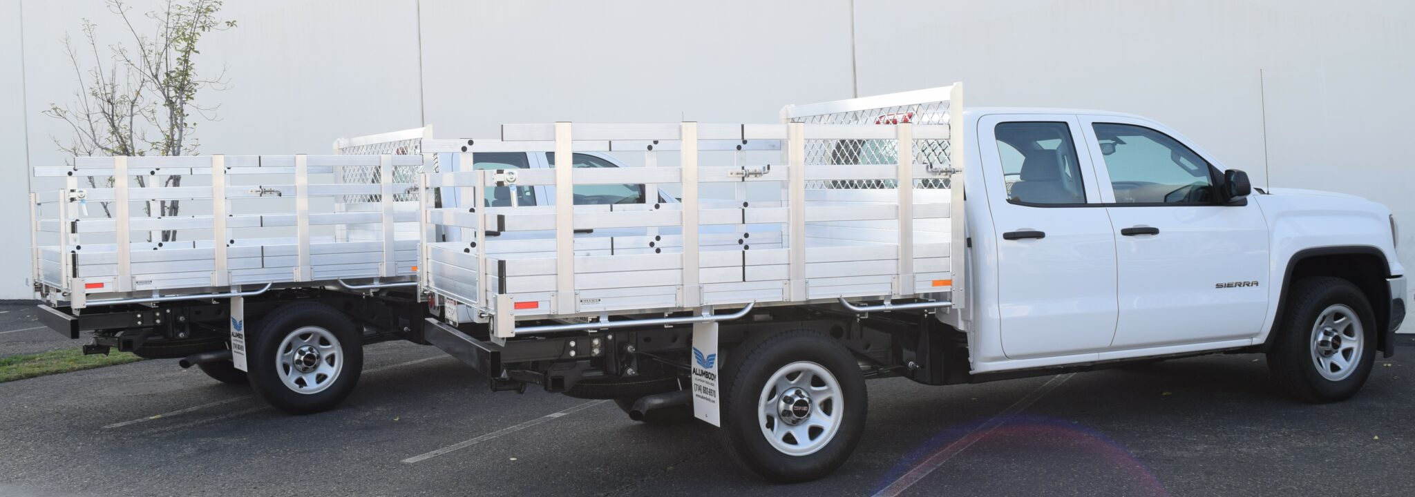 2016 GMC 1500's, with 6'6''x7'6'' aluminum bodies, 30'' lift out side gates, 22" fold down rear gates, using dock bumpers on both