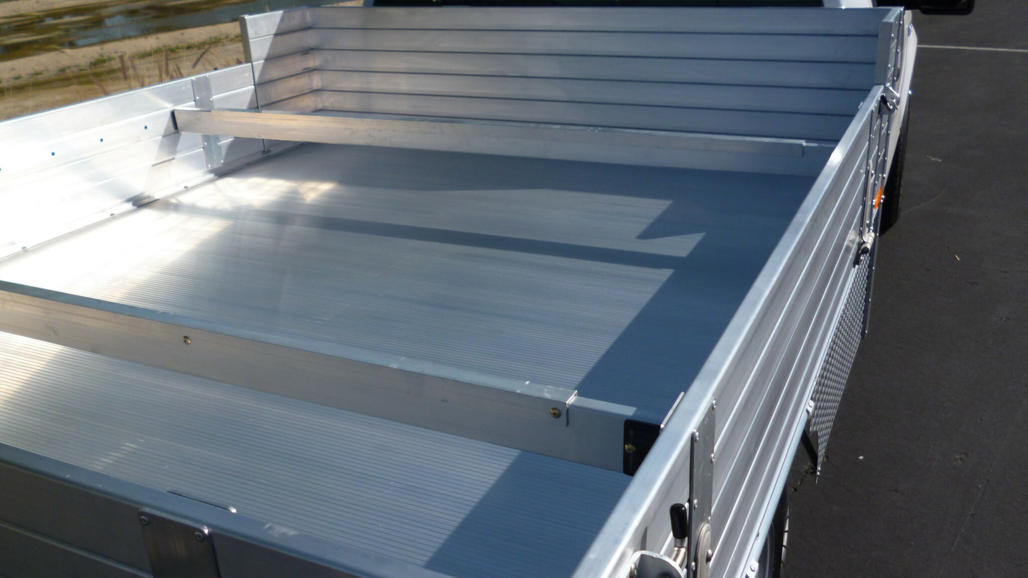 2014 F150 with a 81"×8' AlumBody pool truck bed, 12" solid fold-down gates showing 3 load bars