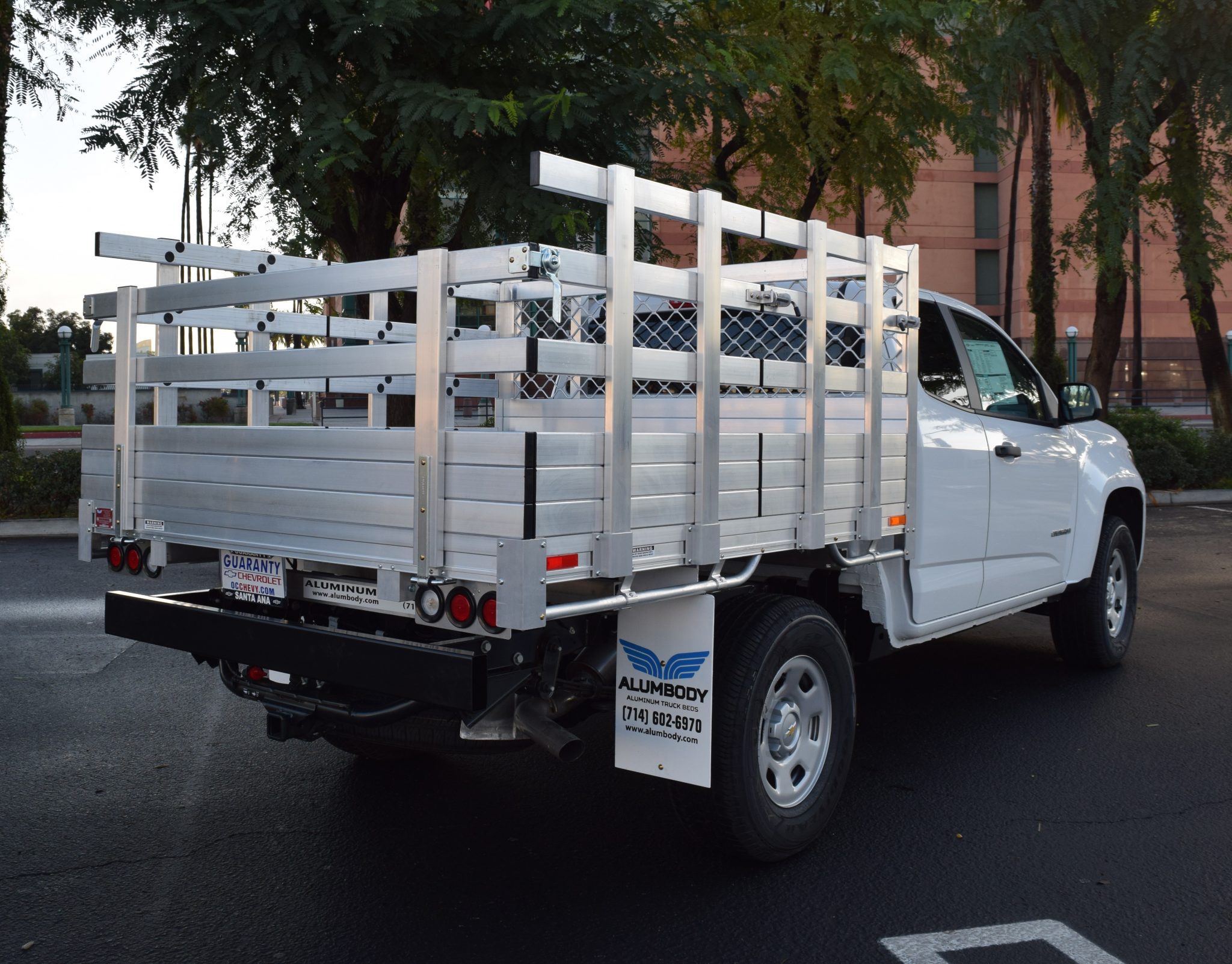 2018 Chevy Colorado with a 6' X 7' AlumBody aluminum stake bed with 33" lift out stakes and 22" rear fold down gate and dock bumper
