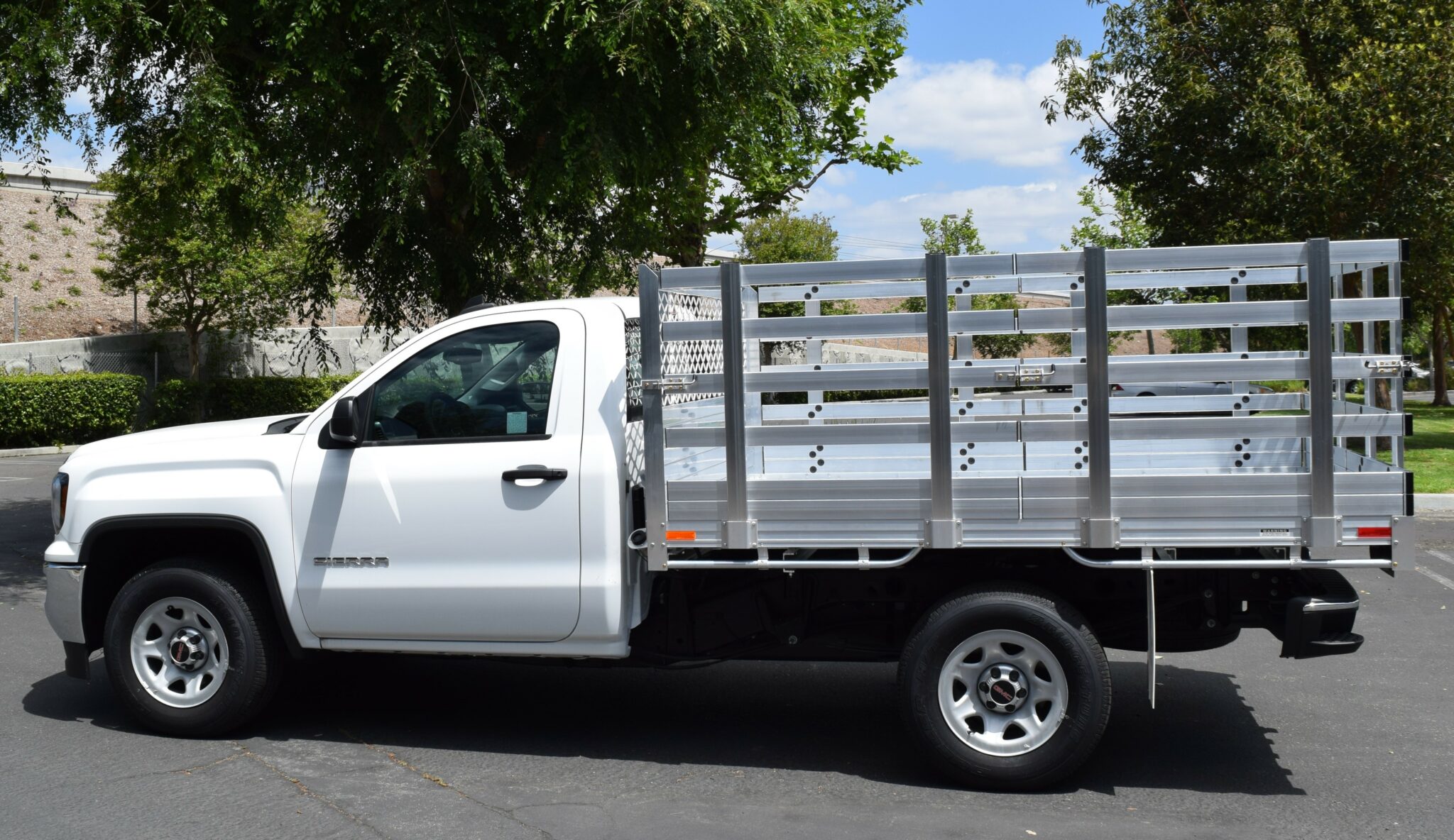 2017 GMC 1500, with a 6'6''x9' aluminum body 38'' lift out gates using the factory bumper.