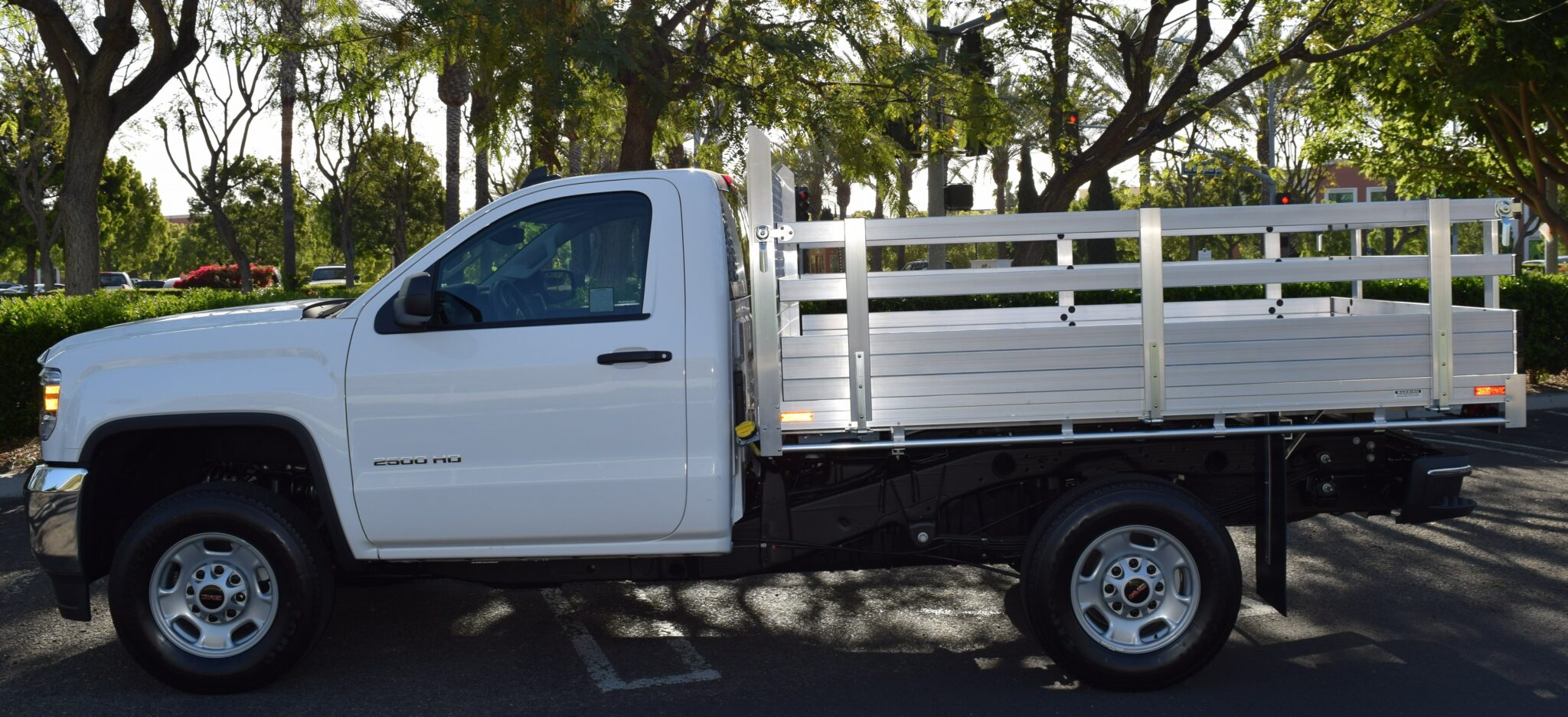 2016 GMC 2500, with a 6'6'' X 9' AlumBody aluminum flat bed 25'' fold down gates, using the factory bumper.