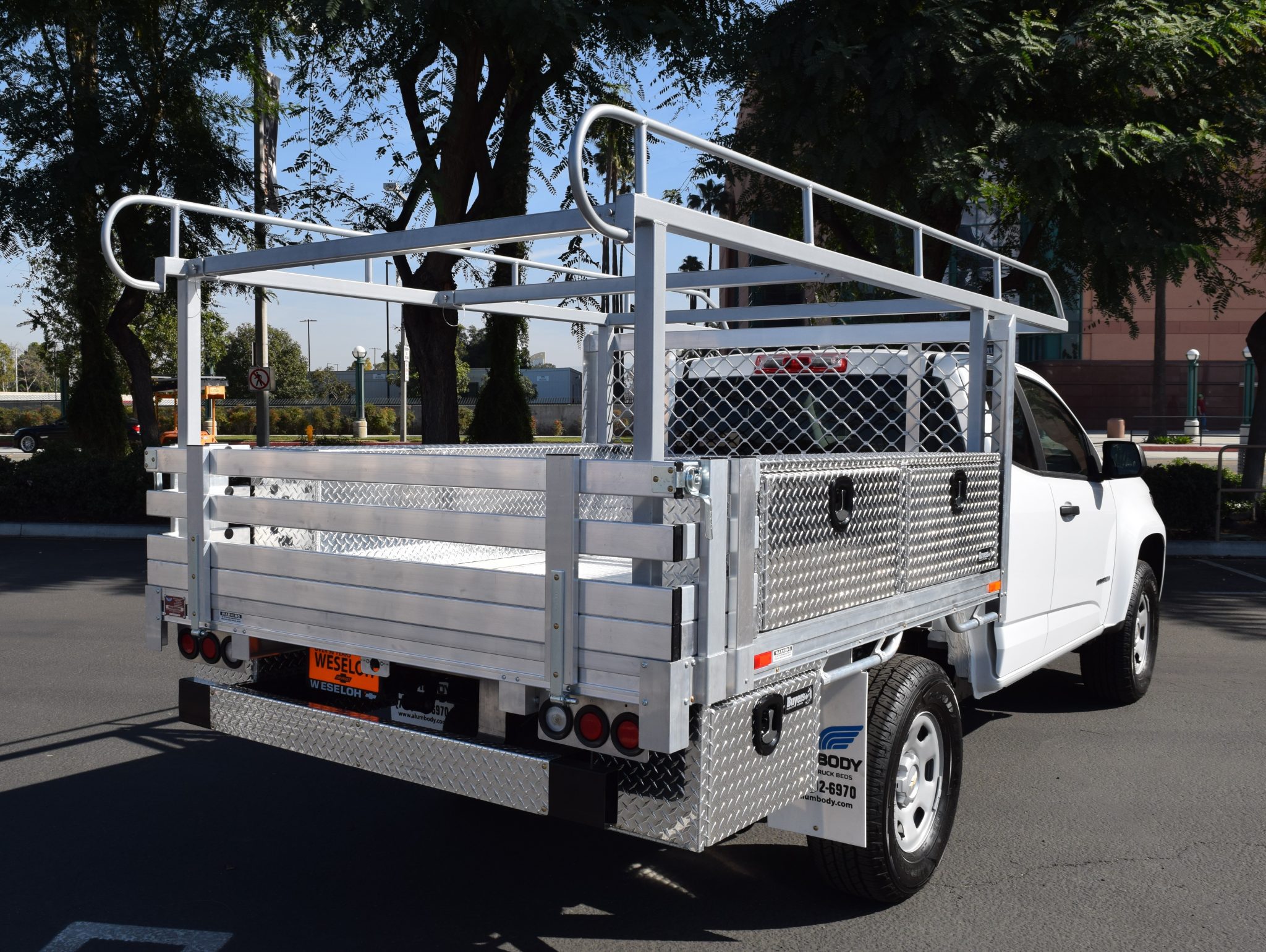 Chevy Colorado with a 6’ X 7’ AlumBody aluminum flat bed, 2 topsider tool boxes 16” X 13” X 72”, 2 underbody tool boxes 14” X 12” X 24”, ladder rack, and dock bumper