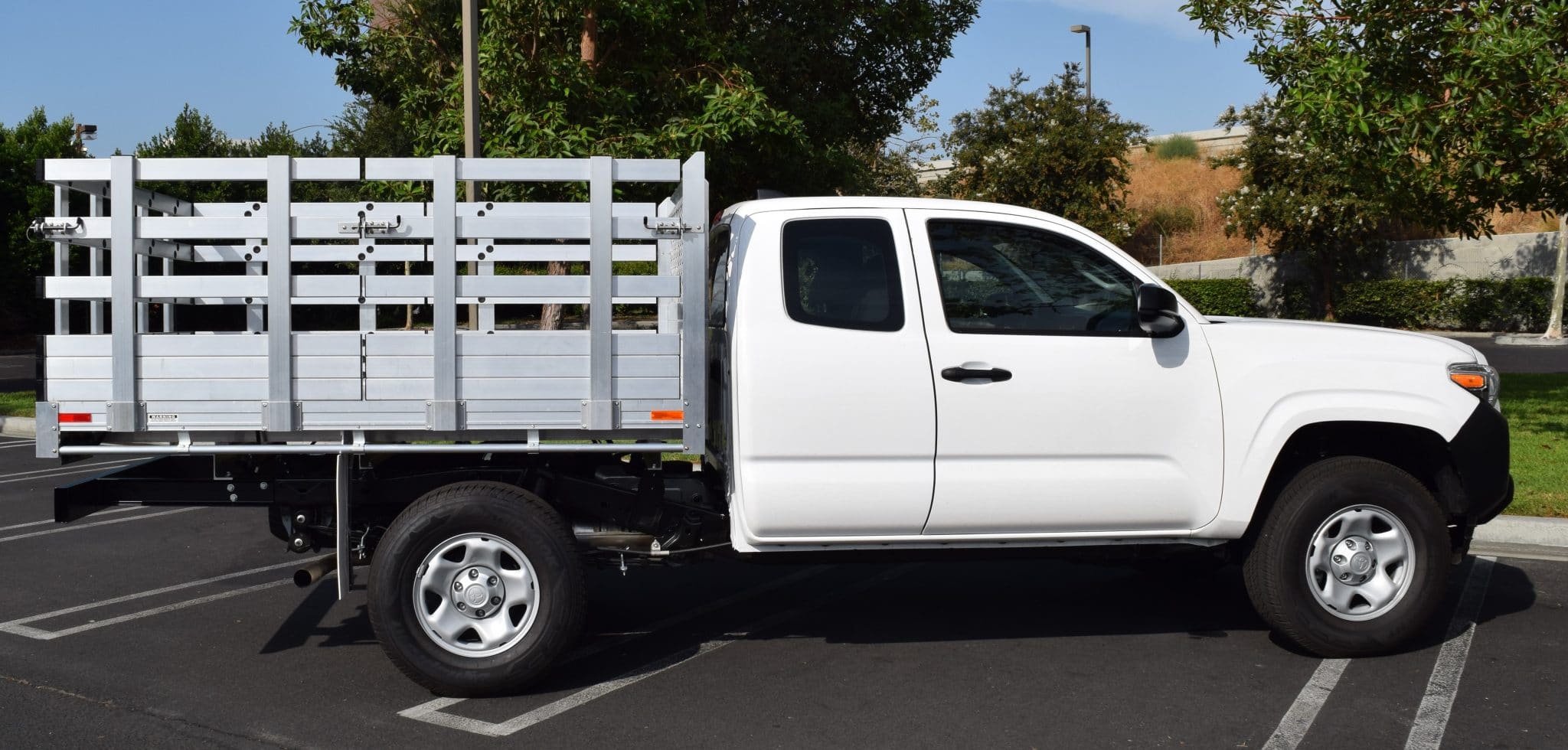 2021 Toyota Tundra, 6'6" x 7' aluminum stake bed, 38" lift-out sides with cross-bar handles, barn doors in the rear, 2-step dock bumper