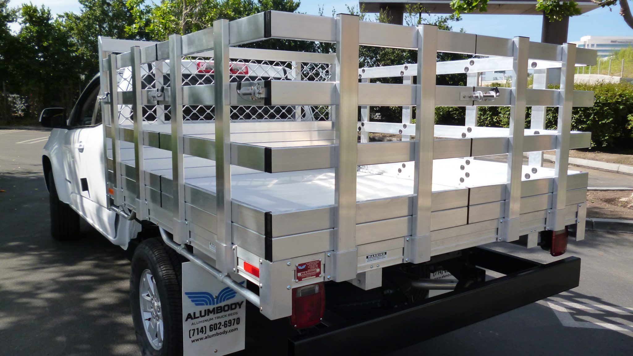 2015 Chevy Colorado with a 6' X 7' AlumBody aluminum stake bed with 30" lift out stakes and dock bumper