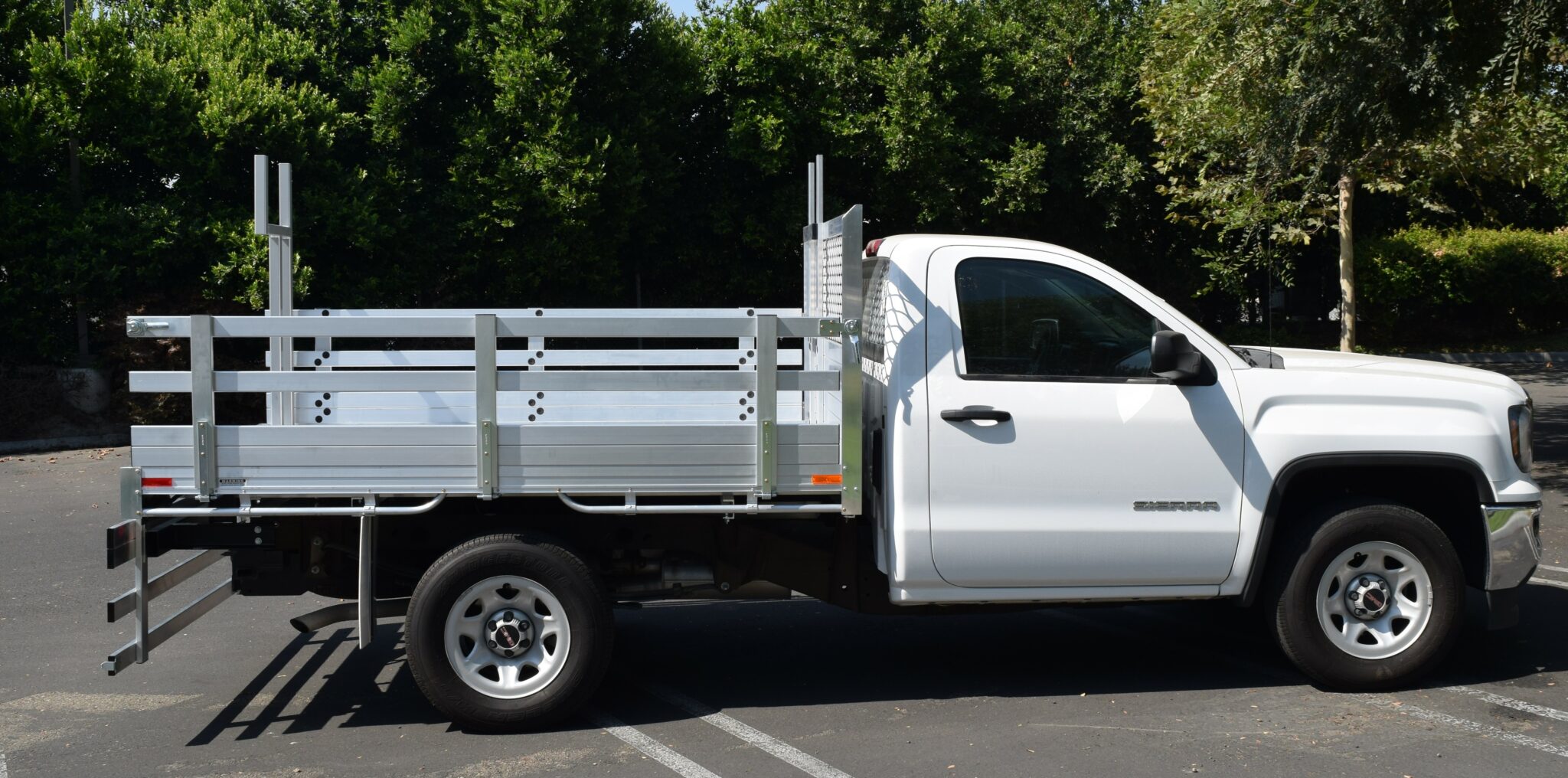 2016 GMC 1500, with a 6'6''x9' aluminum body, 22" fold down gates, custom pipe rack, and dock bumper.