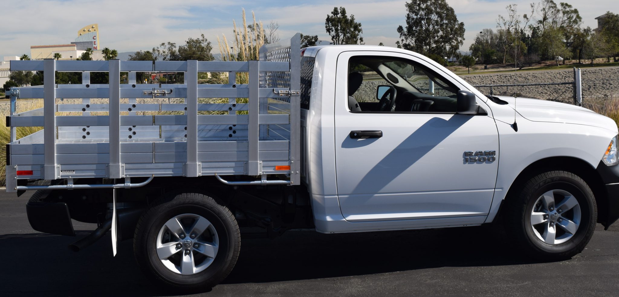 2016 Ram 1500 with a 6'6" X 7' AlumBody aluminum stake bed with 30" lift out stakes and a 22" fold down rear gate using the factory bumper