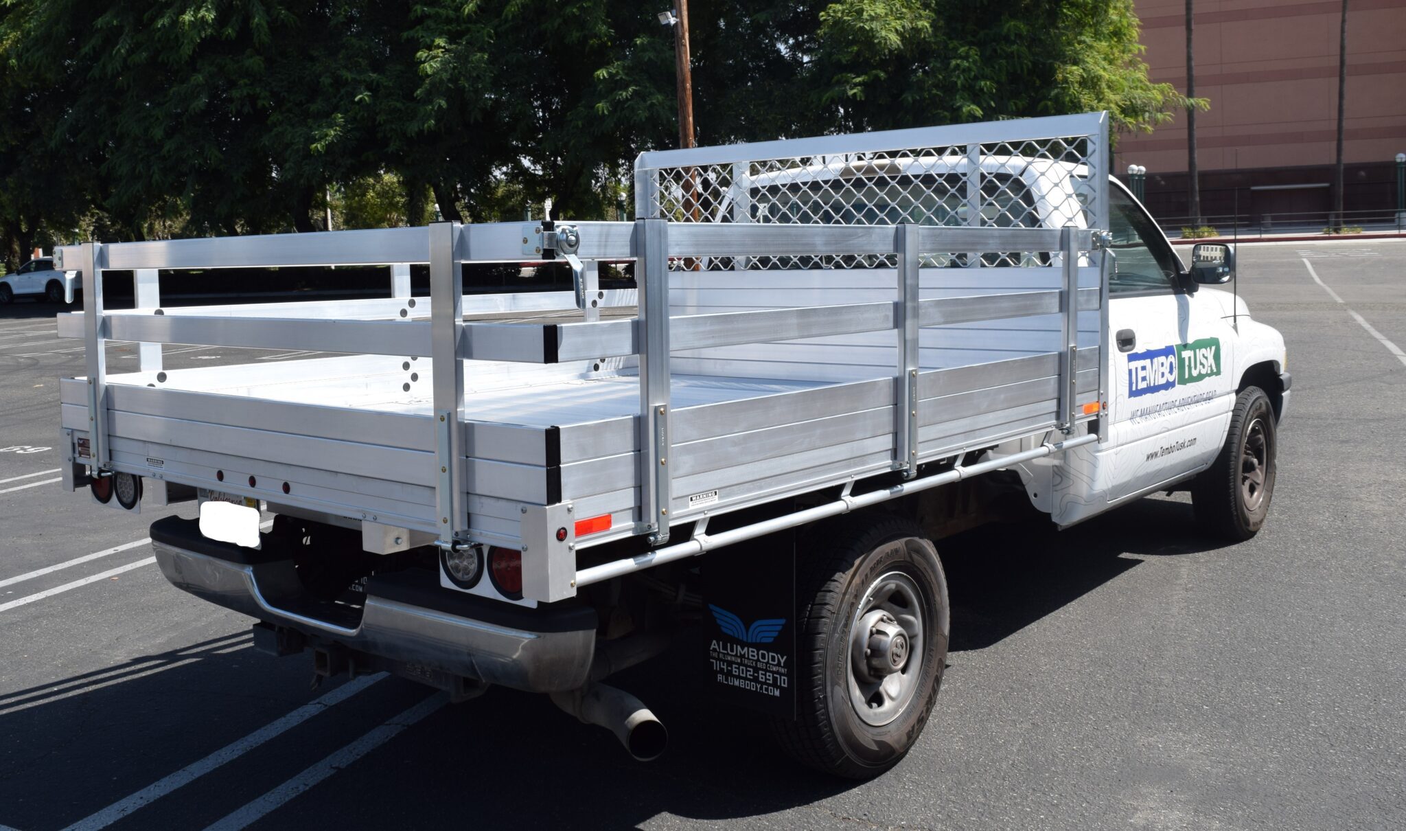 1995 Ram 1500, 7'x9' aluminum flatbed with 22'' fold down gates, using the factory bumper