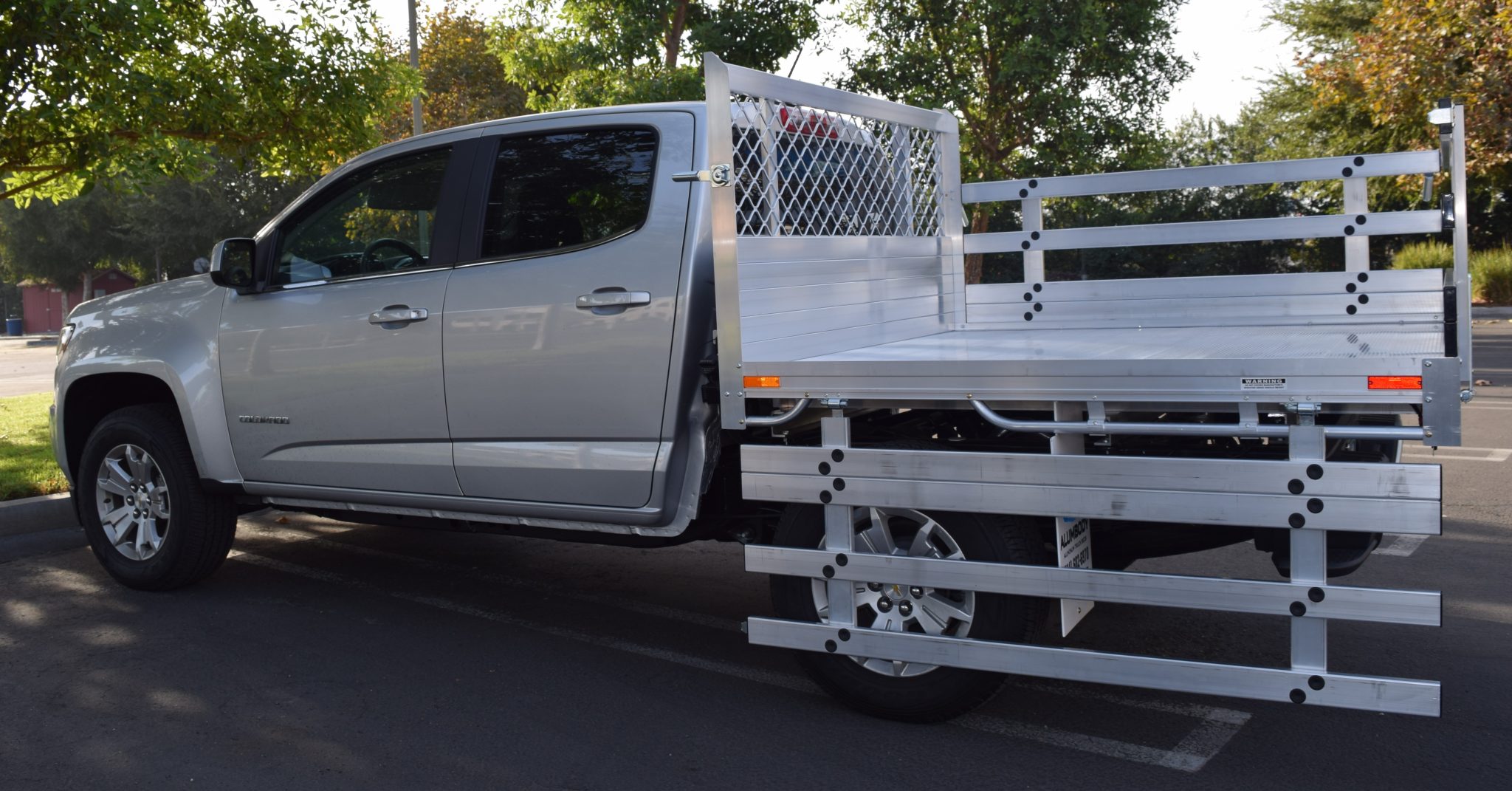 2016 Chevy Colorado with a 6' X 6 AlumBody aluminum flat bed with 22" fold down gates using the factory bumper