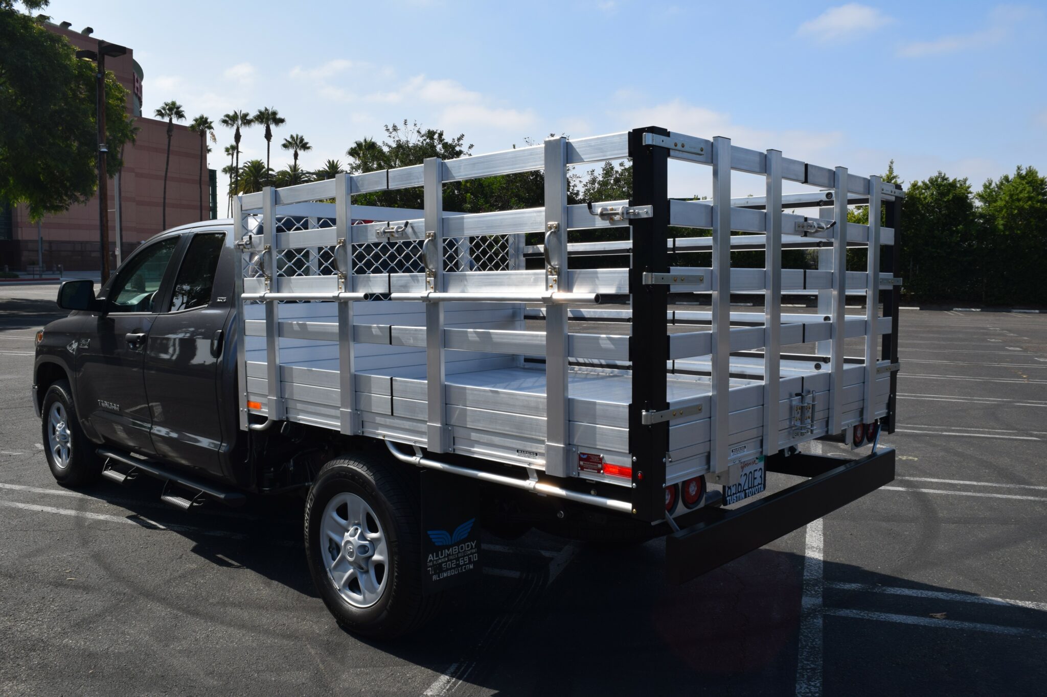 2008 Toyota Tundra with a 6'6" X 7' AlumBody aluminum flat bed, 22" fold-down gates using the factory bumper