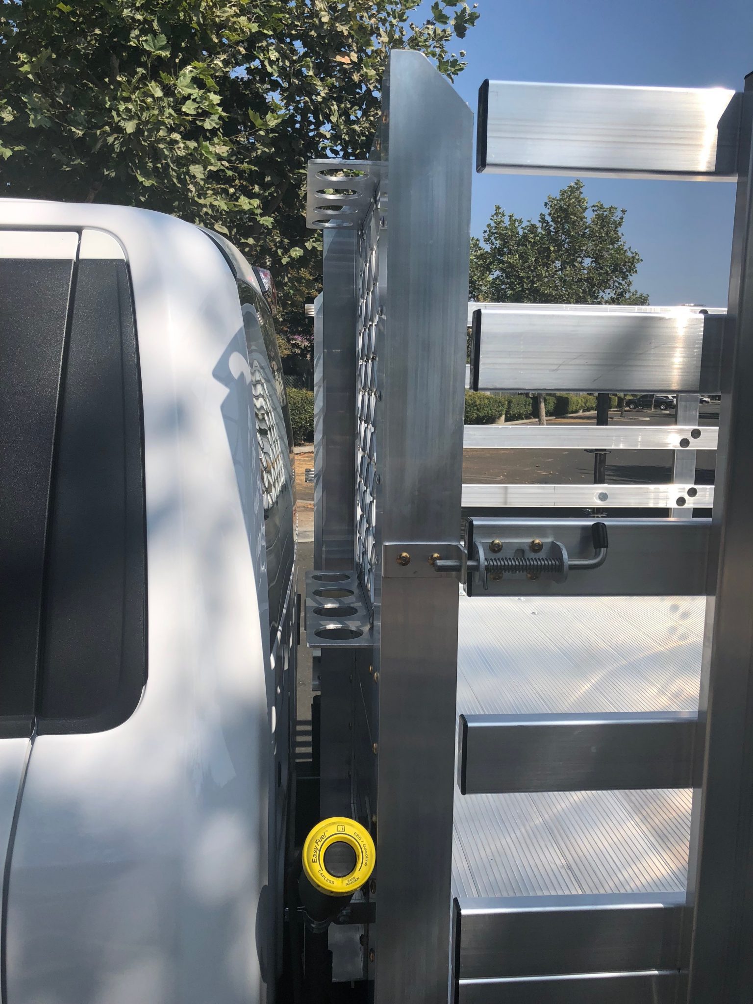 2018 Ford F150 with custom rake and broom rack installed between headboard and cab