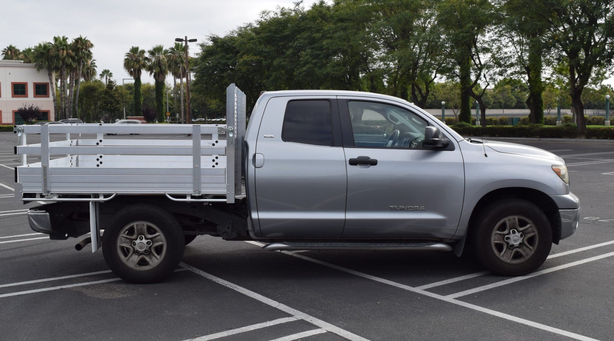2013 Toyota Tacoma with a 6'X7' AlumBody aluminum flat bed, 22" fold-down gates and dock bumper