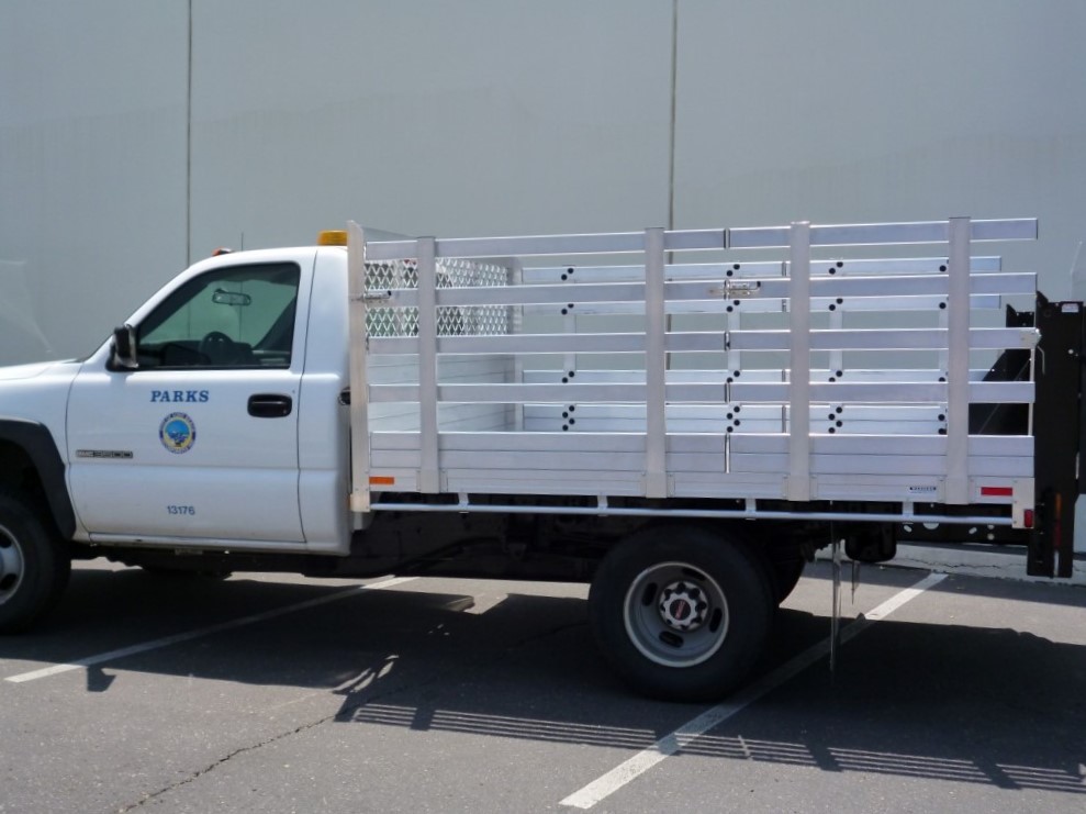 GMC 3500 SRW with a 7'x10' aluminum bed, 38'' lift out sides and Tommy liftgate