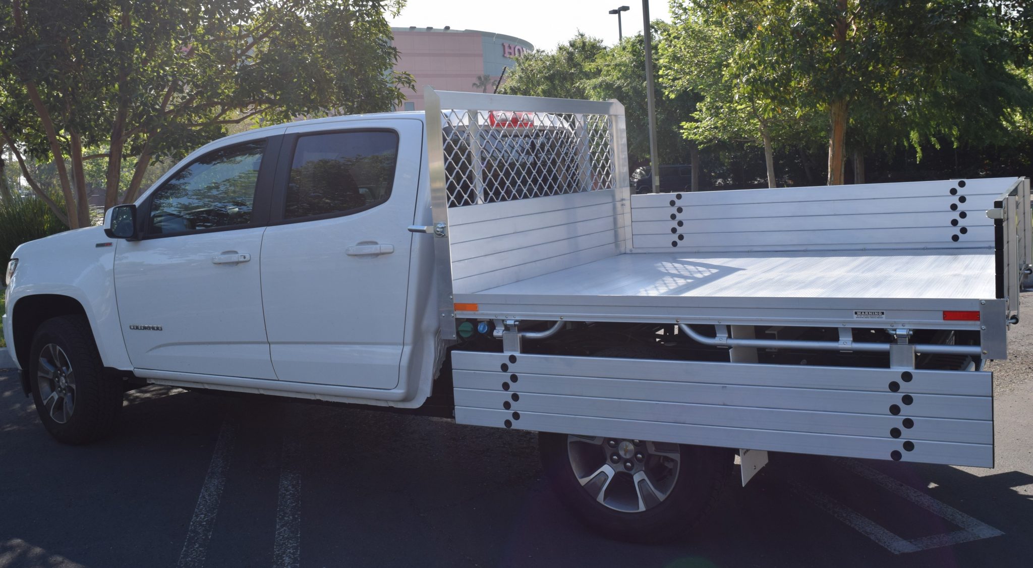 2017 Chevy Colorado with a 6' X 7' AlumBody aluminum flat bed with 12" fold down gates and dock bumper