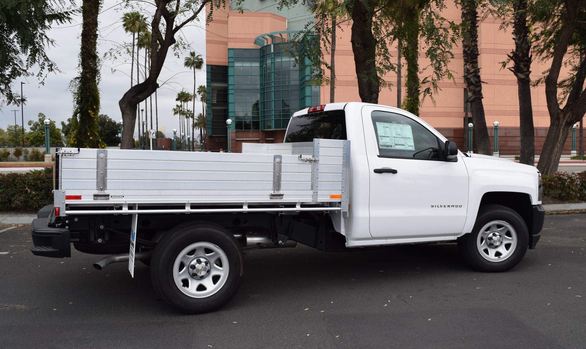 2018 Chevy Silverado 1500 with an 81" × 8' AlumBody aluminum pool truck bed with 12" solid fold-down gates using stainless steel hardware and the factory bumper