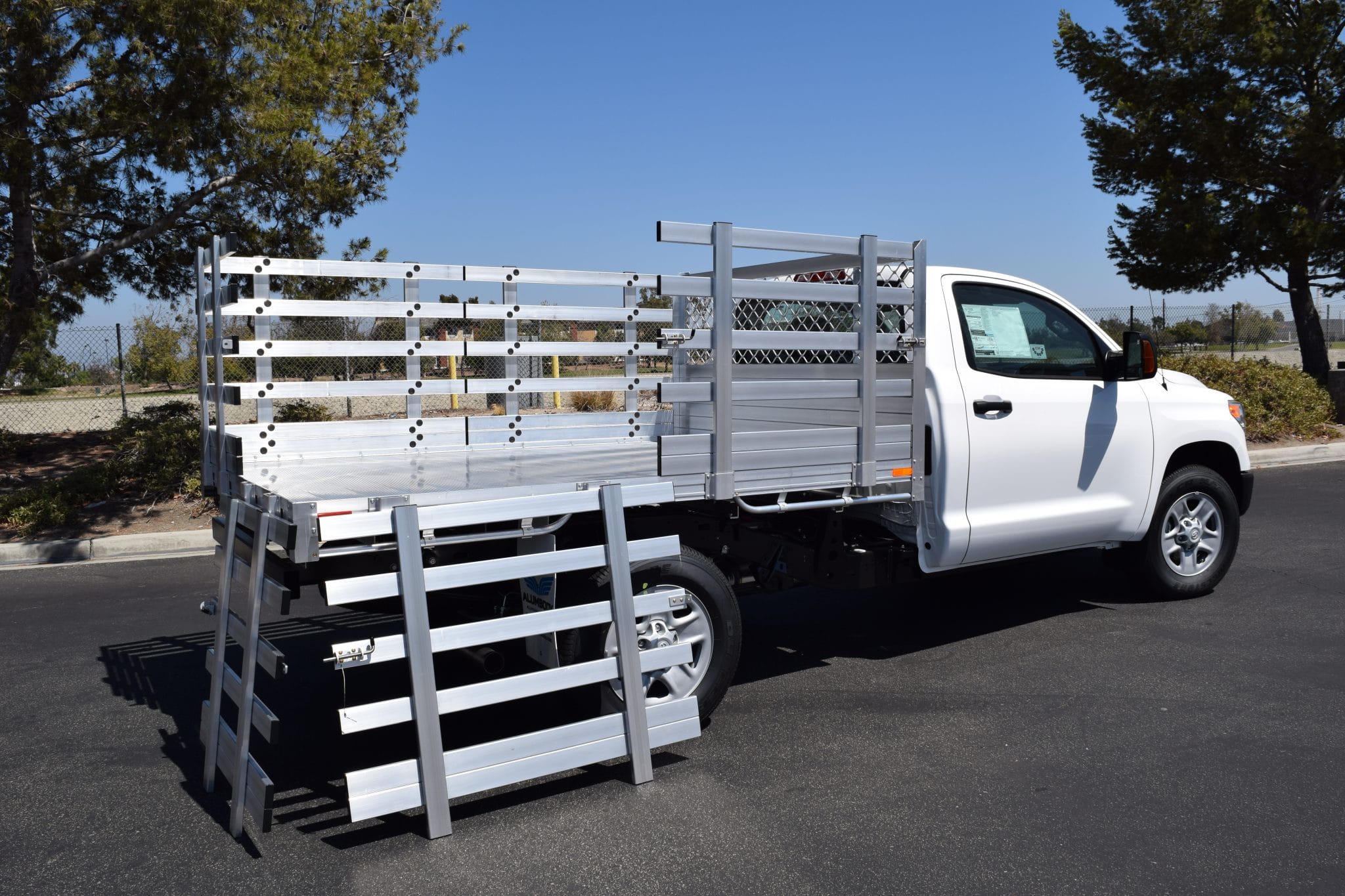 2018 Toyota Tacoma with a 6'X7'6" AlumBody stake bed, 30" lift-out gates, dock bumper