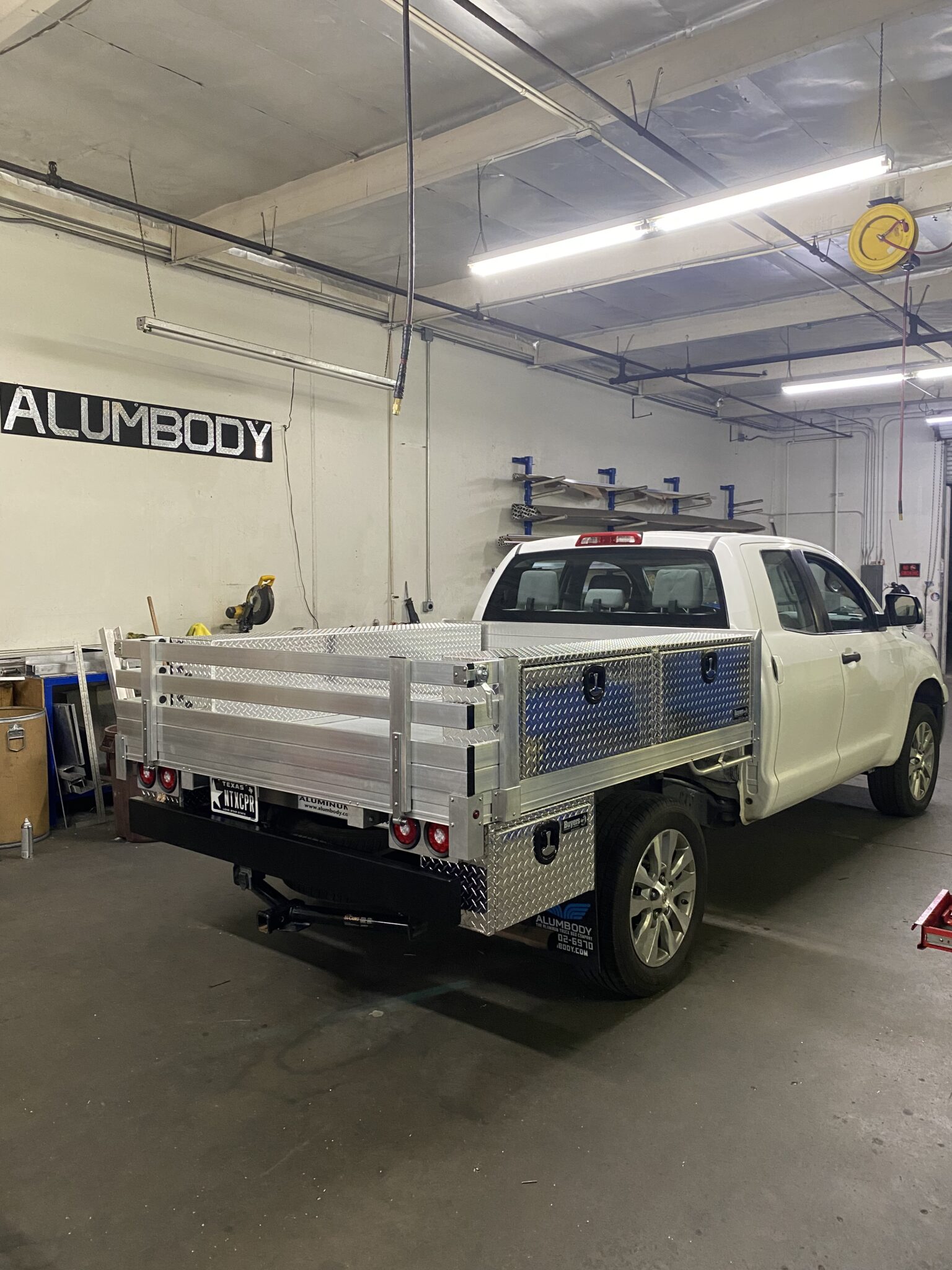 2008 Toyota Tundra 6’6” x 7’ aluminum bed with fold-down rear gate, 2 underbody tool boxes 14”X12”X30”, 2 over-body tool boxes 16”x13”x72”, dock bumper and hitch