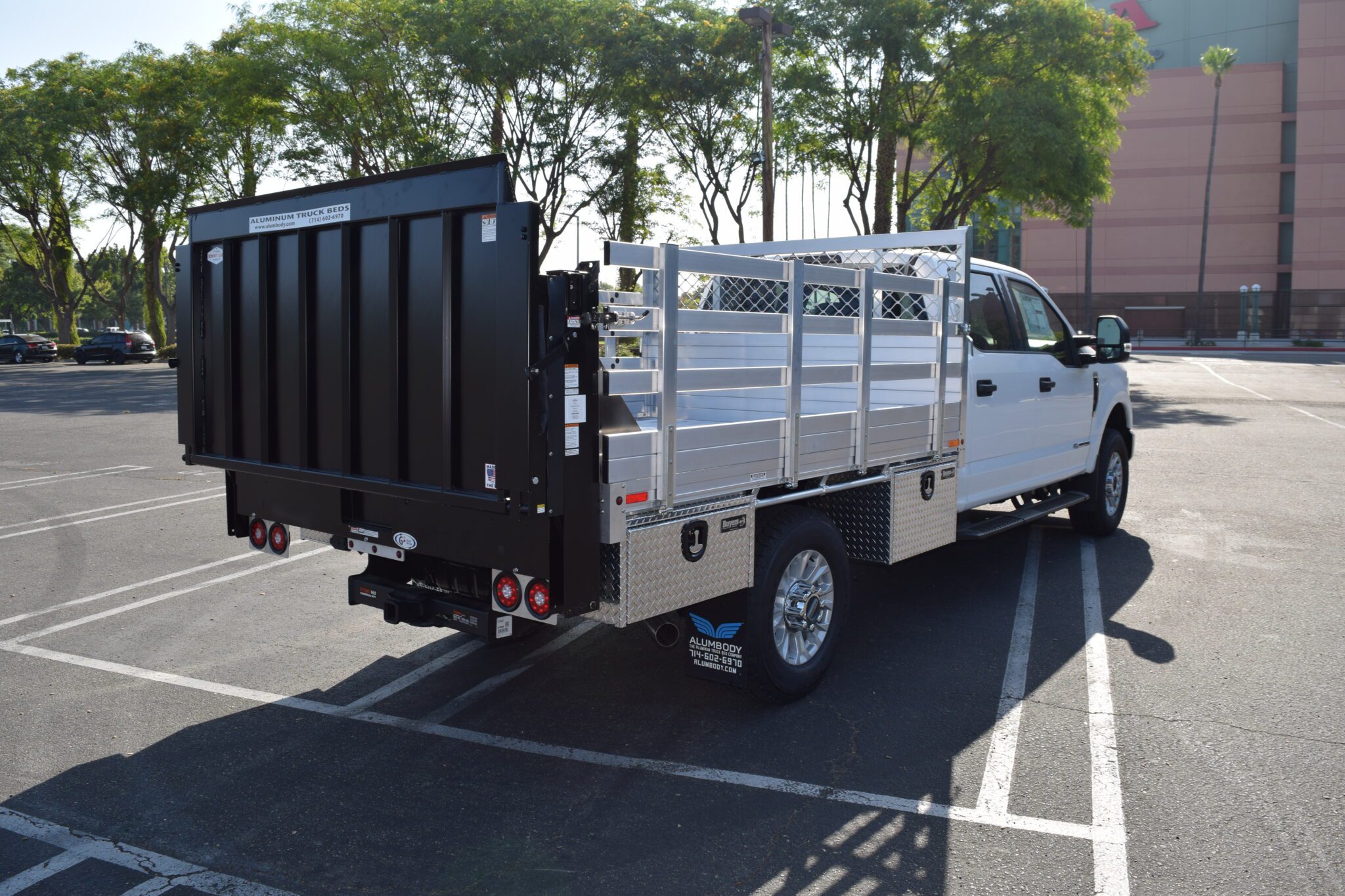 2021 Ford F350 with a 7×9 aluminum stake bed, 30" lift-out sides, lift gate in the rear, hitch, 4 underbody tool boxes