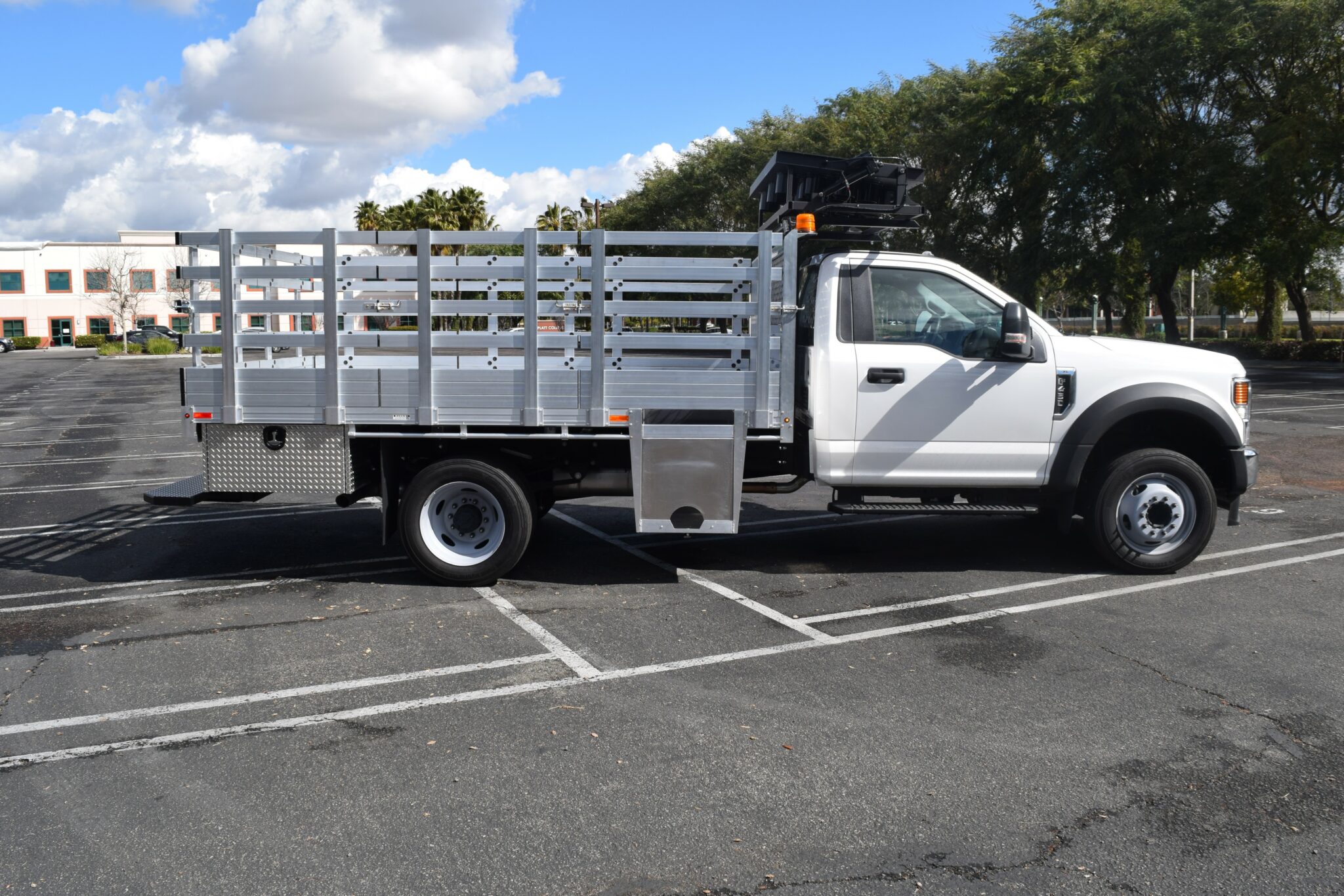 2020 F450 with an 8×12 aluminum bed with 41" lift-out stakes, 2 underbody toolboxes, cone drop support, beacon strobe flood arrow board rack, dock bumper and hitch