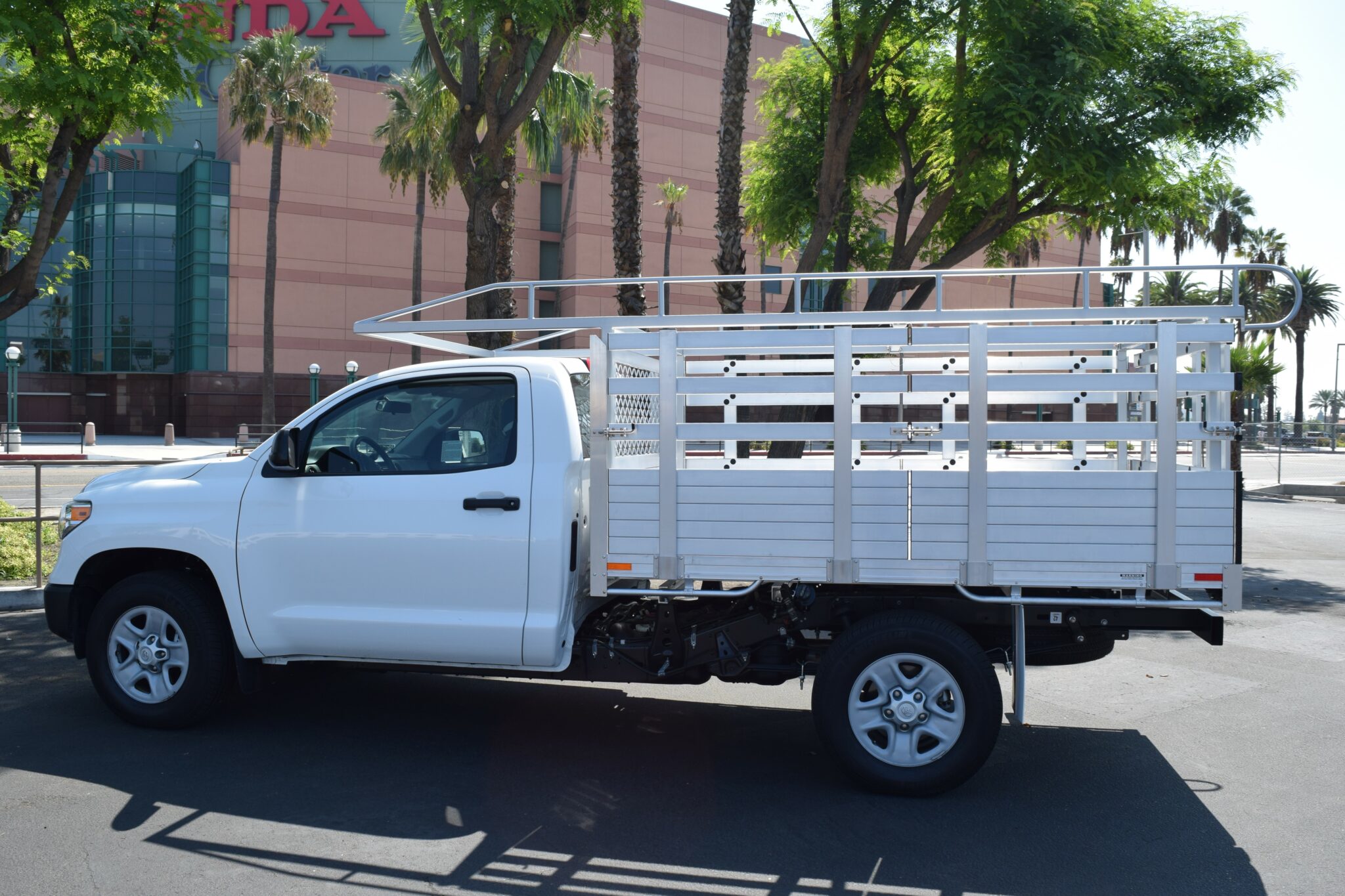 2017 Tundra with a 66×9 Aluminum body, custom lift-out gates, ladder rack and dock bumper