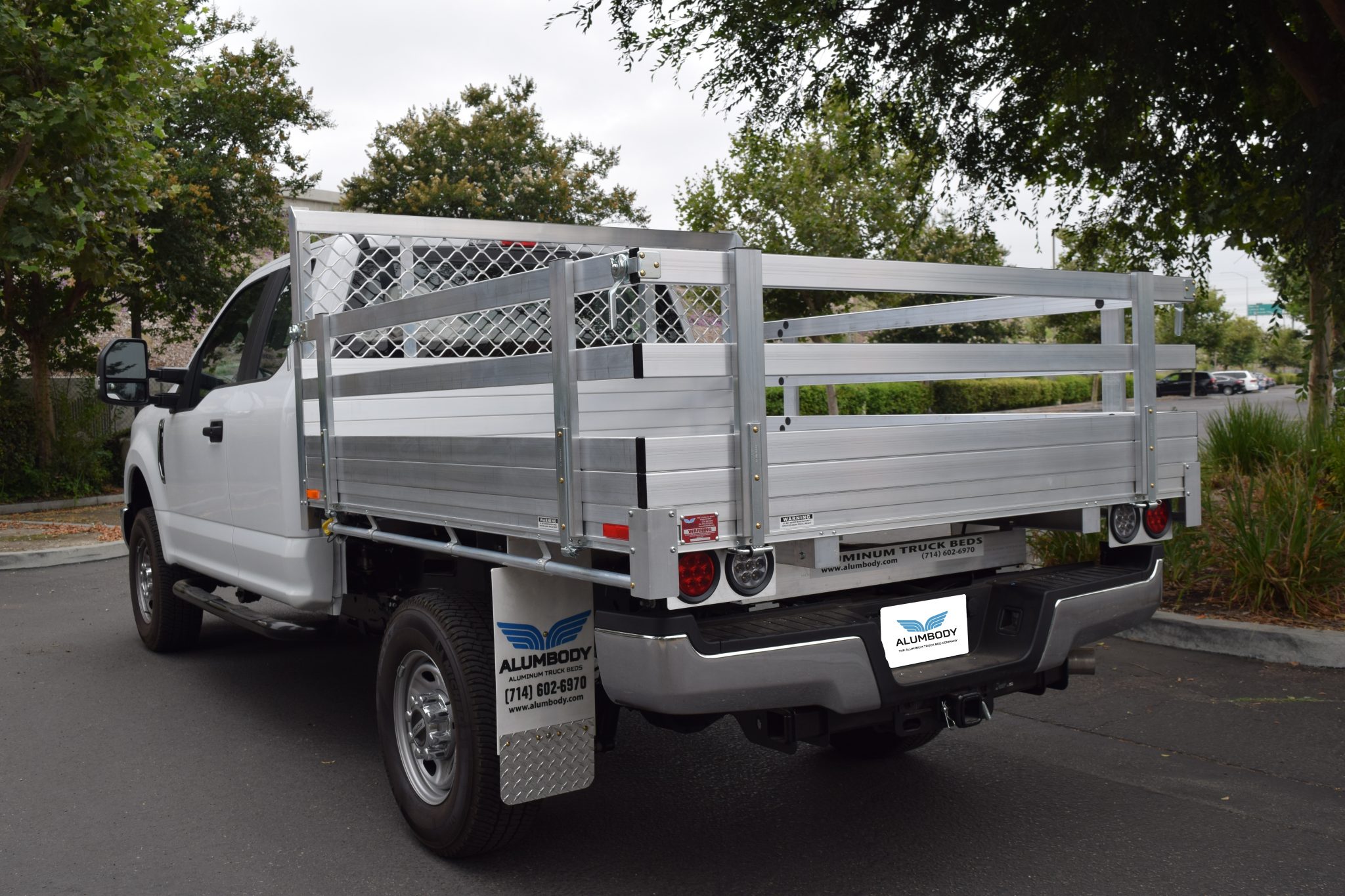 2017 Ford F250 with a 6'6" X 7'6" AlumBody aluminum flat bed with 22" fold down gates and dock bumper