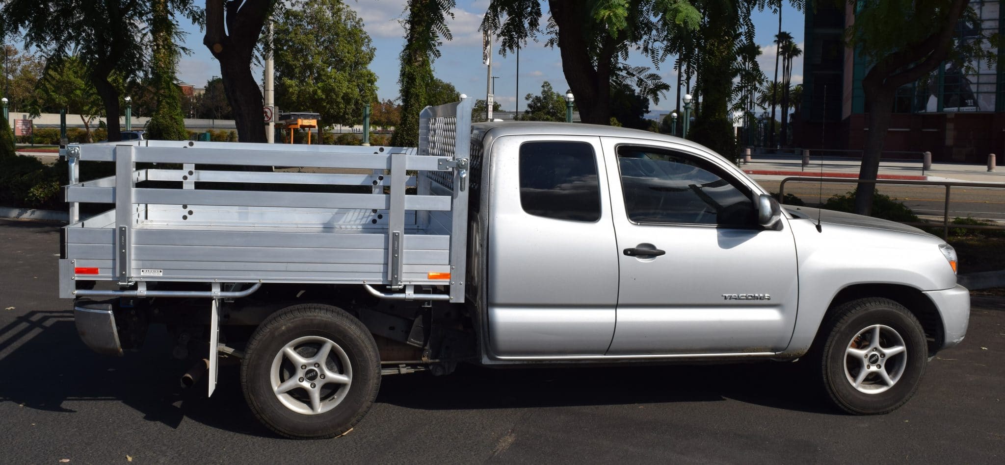 2016 Toyota Tundra with a 6'6" X 9' AlumBody aluminum stake bed, 38" lift-out stakes and dock bumper
