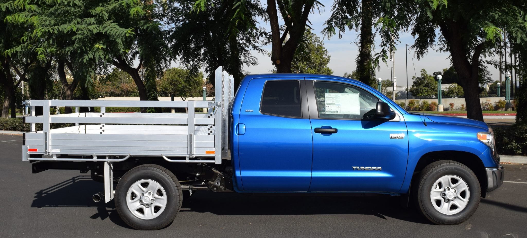 2006 Toyota Tundra with a 6'6" X 7' AlumBody aluminum flat bed, 22" fold-down gates using the factory bumper