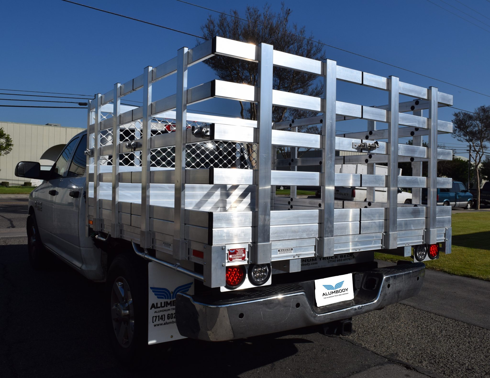 2014 Ram 2500 with a 6'6" X 7' AlumBody aluminum stake bed with 38" lift out stakes using the factory bumper