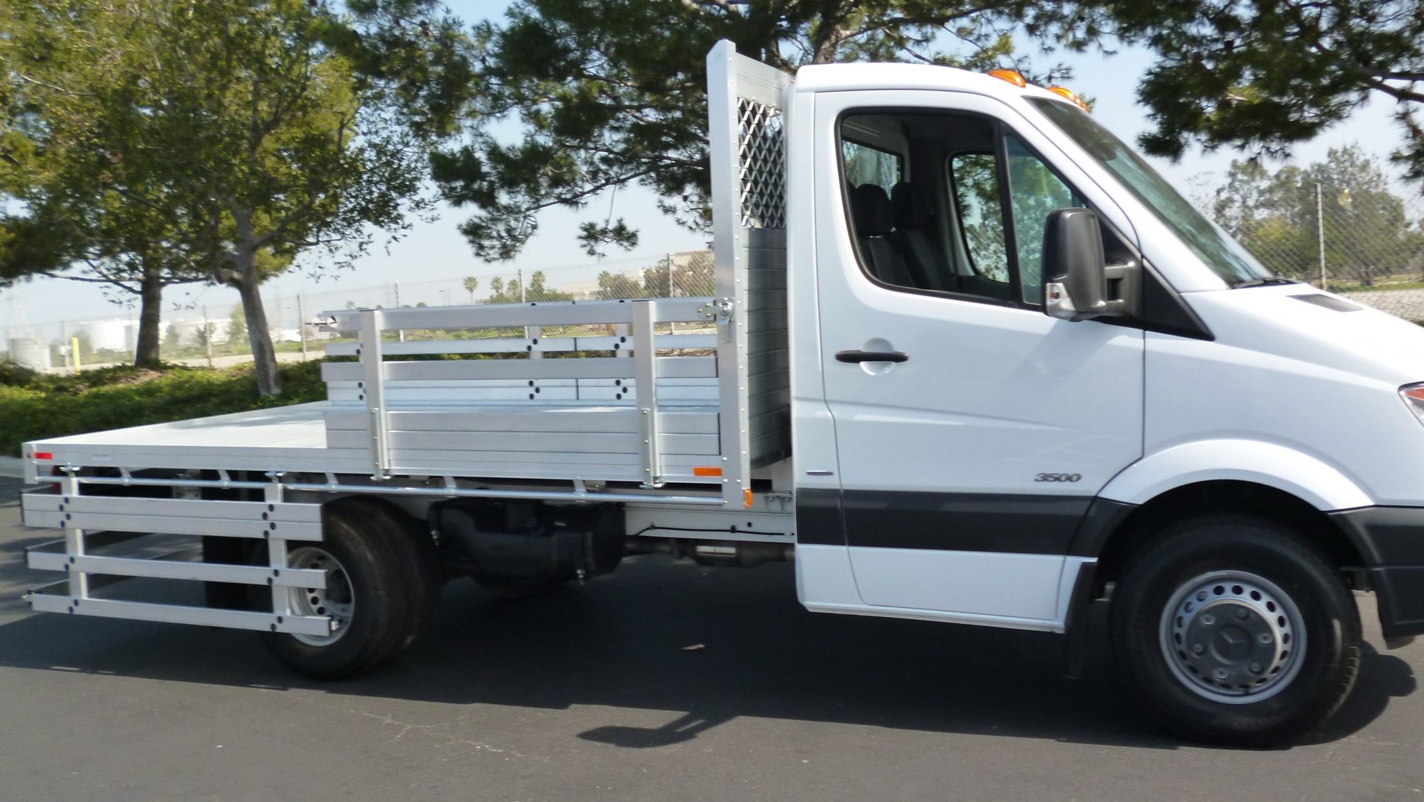 2014 Mercedes-Benz Sprinter 3500 DRW with a 7' X 12' AlumBody aluminum flat bed with 22" fold down gates and dock bumper