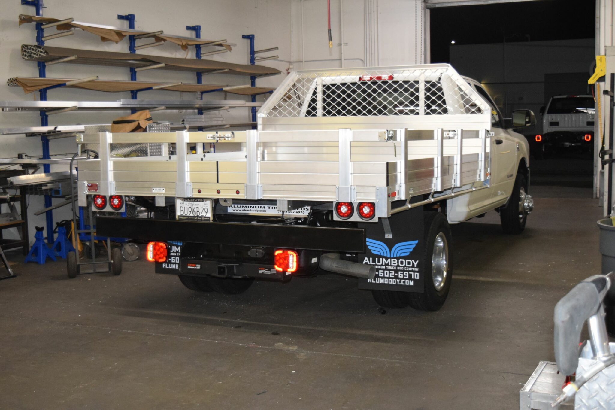 2022 F350 with an 8×96 aluminum bed, 14" fold-down gates, a tapered headboard, dock bumper and hitch