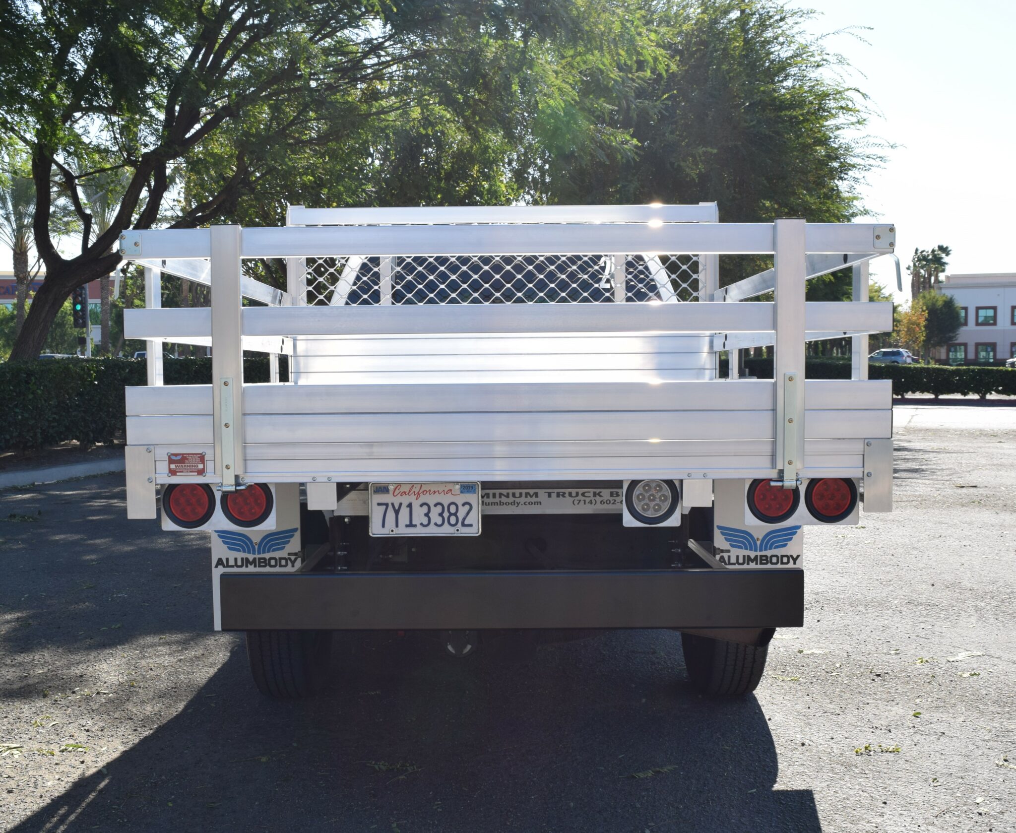 2005 GMC 2500, with a 6'6''x7'6''' aluminum body, 22'' fold down gates, using a Dock Bumper.