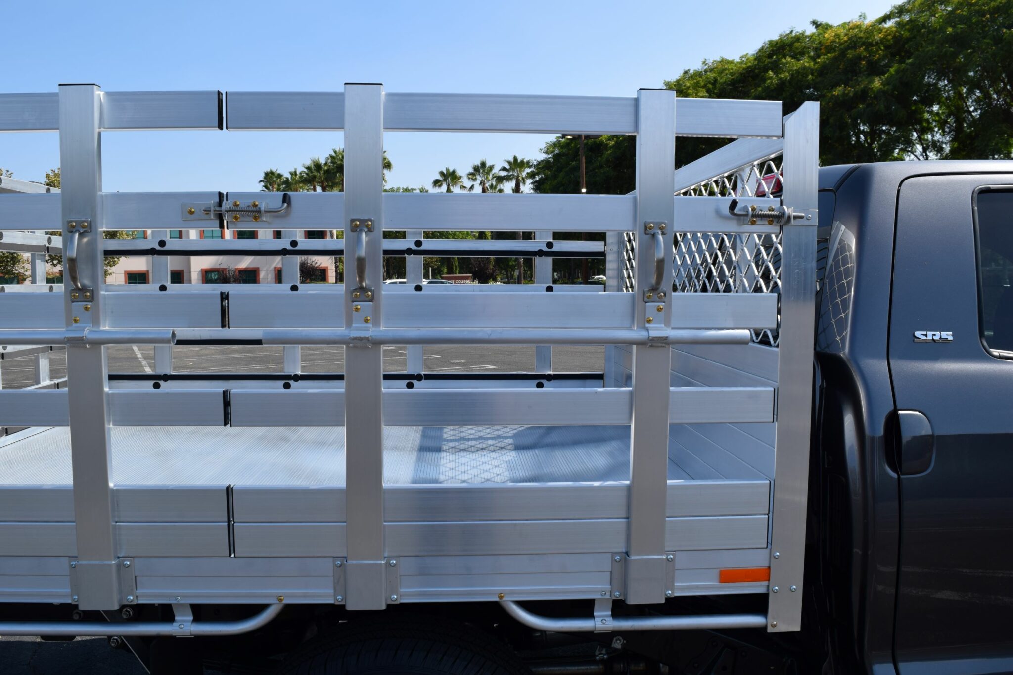 2021 Toyota Tundra 66×8 aluminum stake bed with 38" lift-out stakes and 2 styles of gate handles