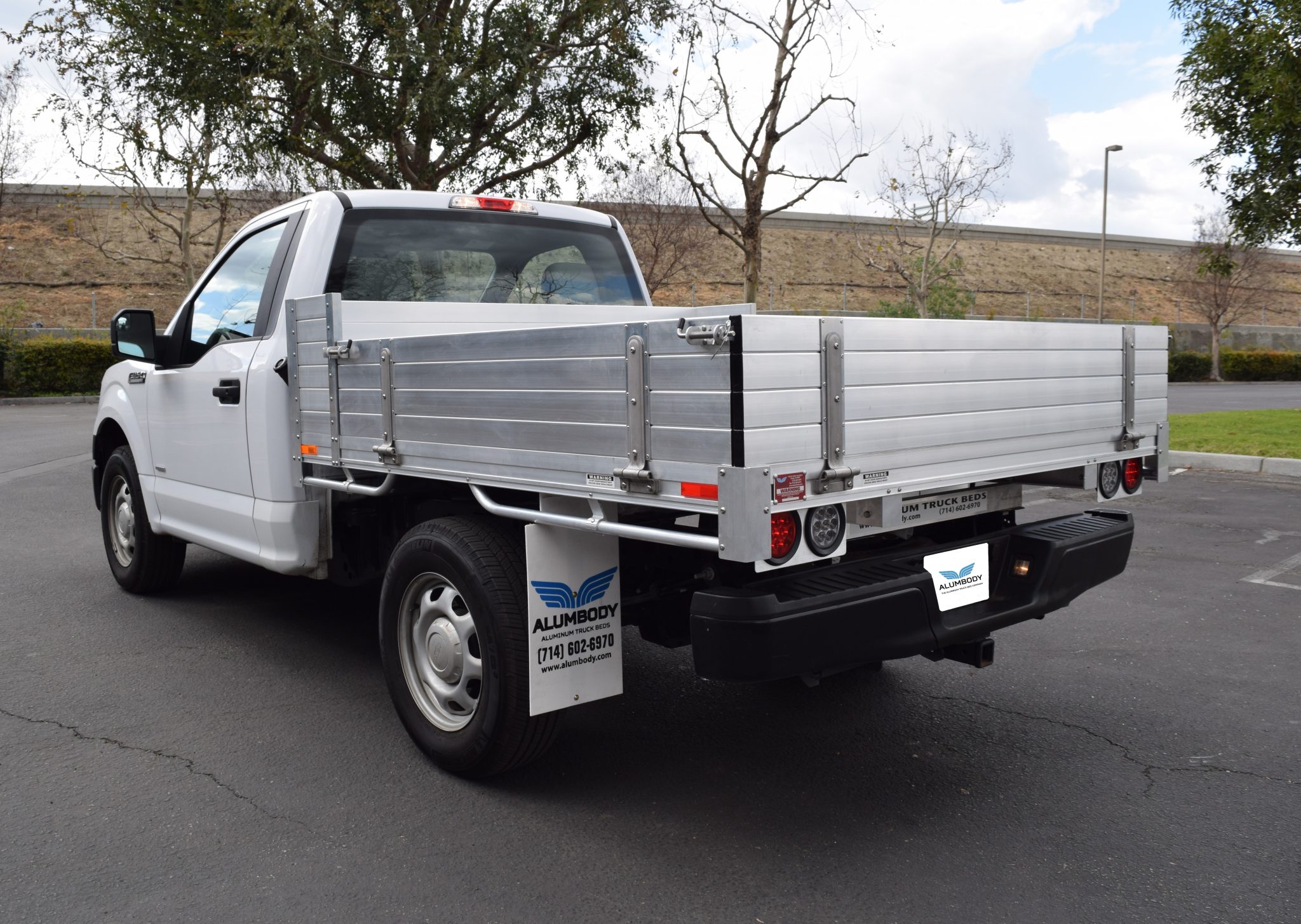 2017 Ford F150 with a 6'6" × 7' AlumBody aluminum pool truck bed with 12" solid fold-down gates using stainless steel hardware and the factory bumper
