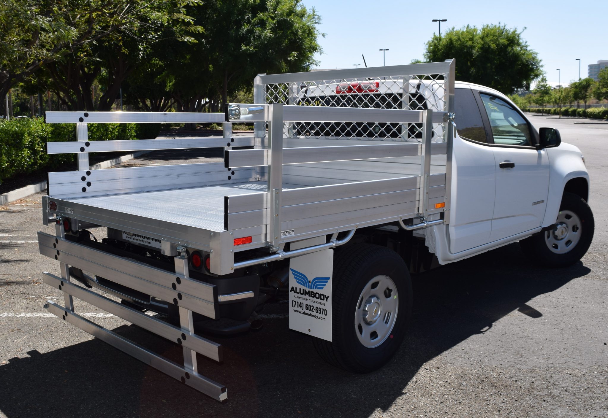 2016 Chevy Colorado with a 6' X 66" AlumBody aluminum flat bed with 22" fold down gates using the factory bumper