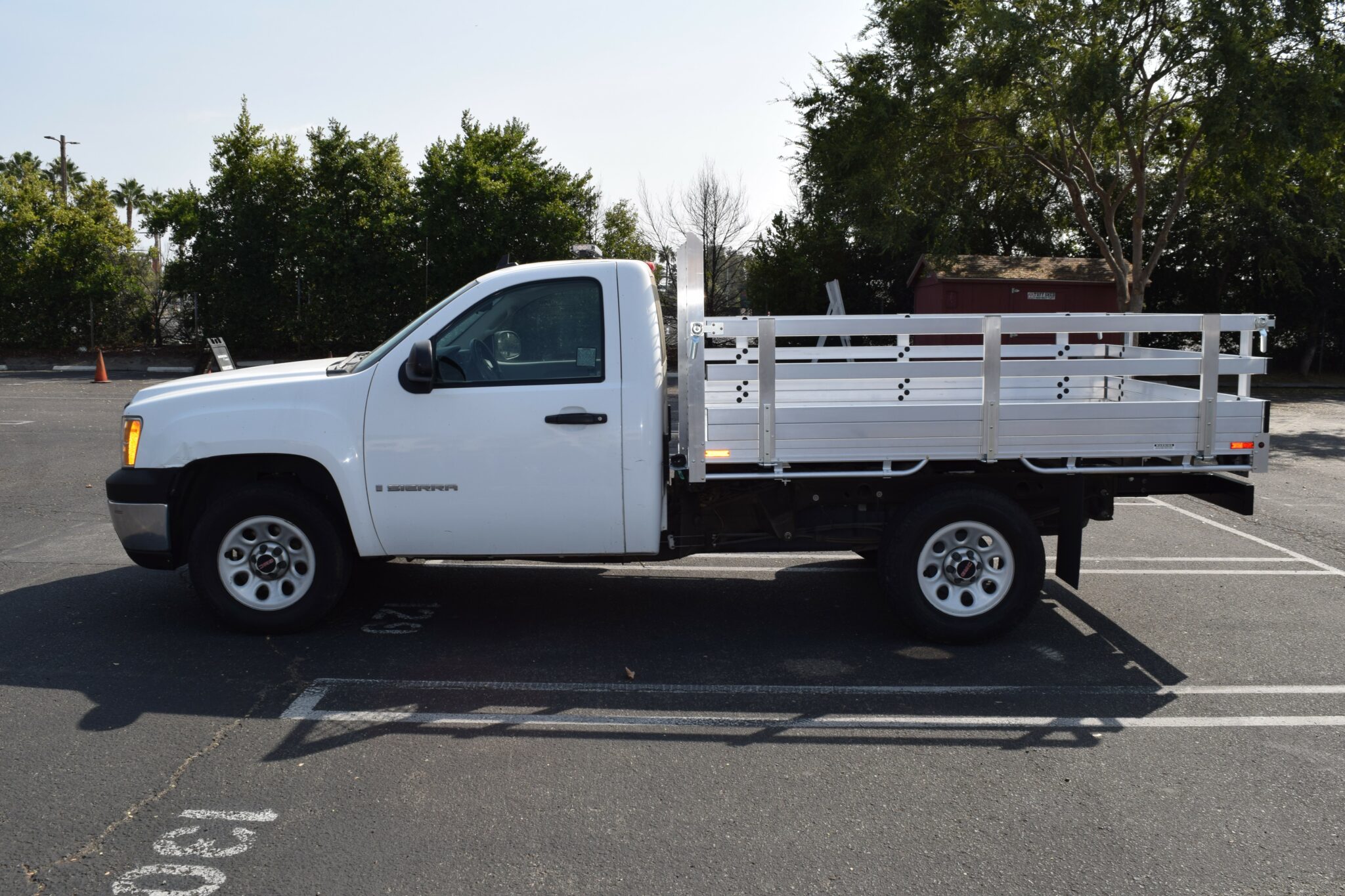 2009 GMC 1500, 6'6''x9' aluminum body, with 22'' fold down gates using the factory bumper