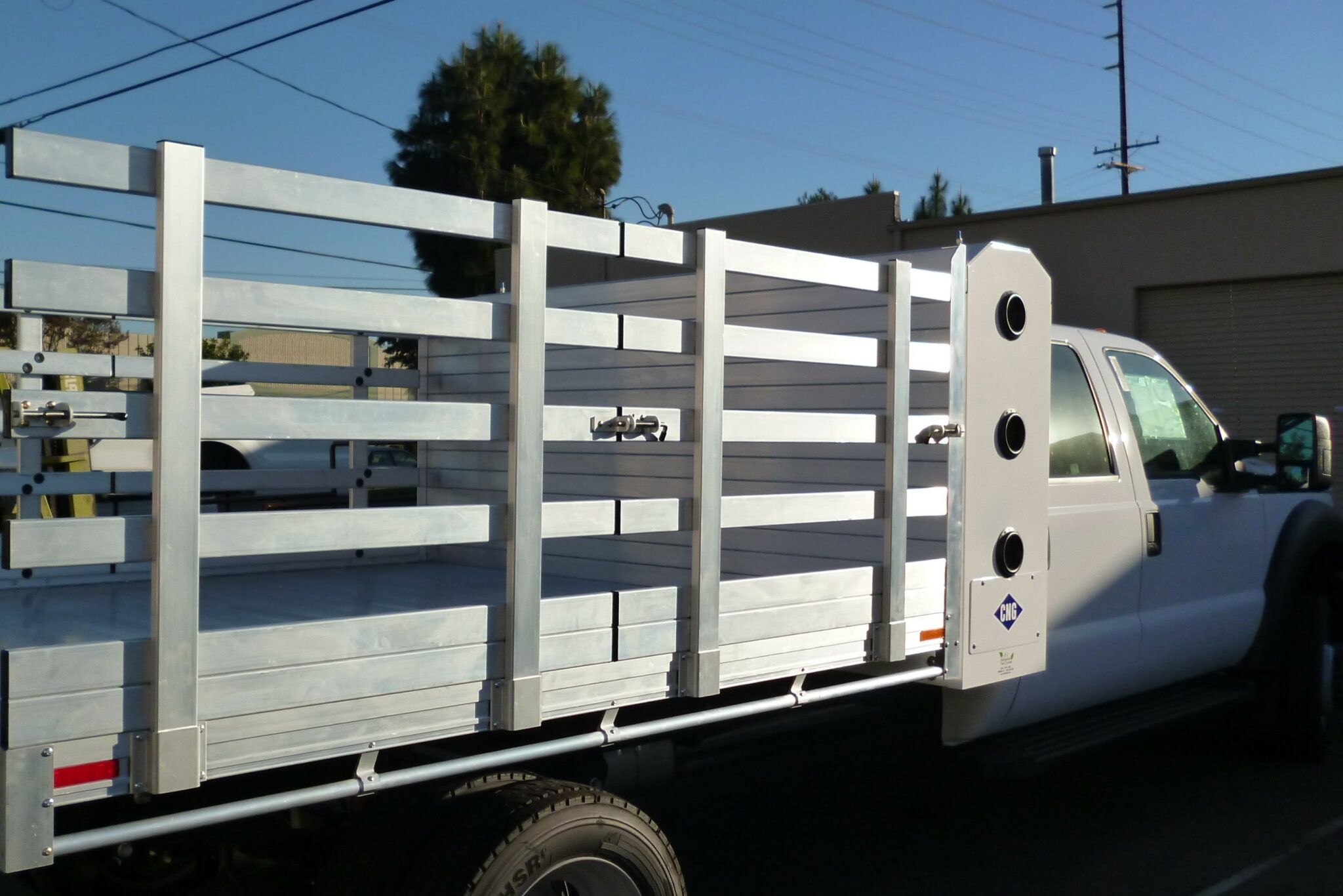 2014 F550 with an 8×10 aluminum body, 38" lift-out sides and custom headboard to accommodate CNG tanks