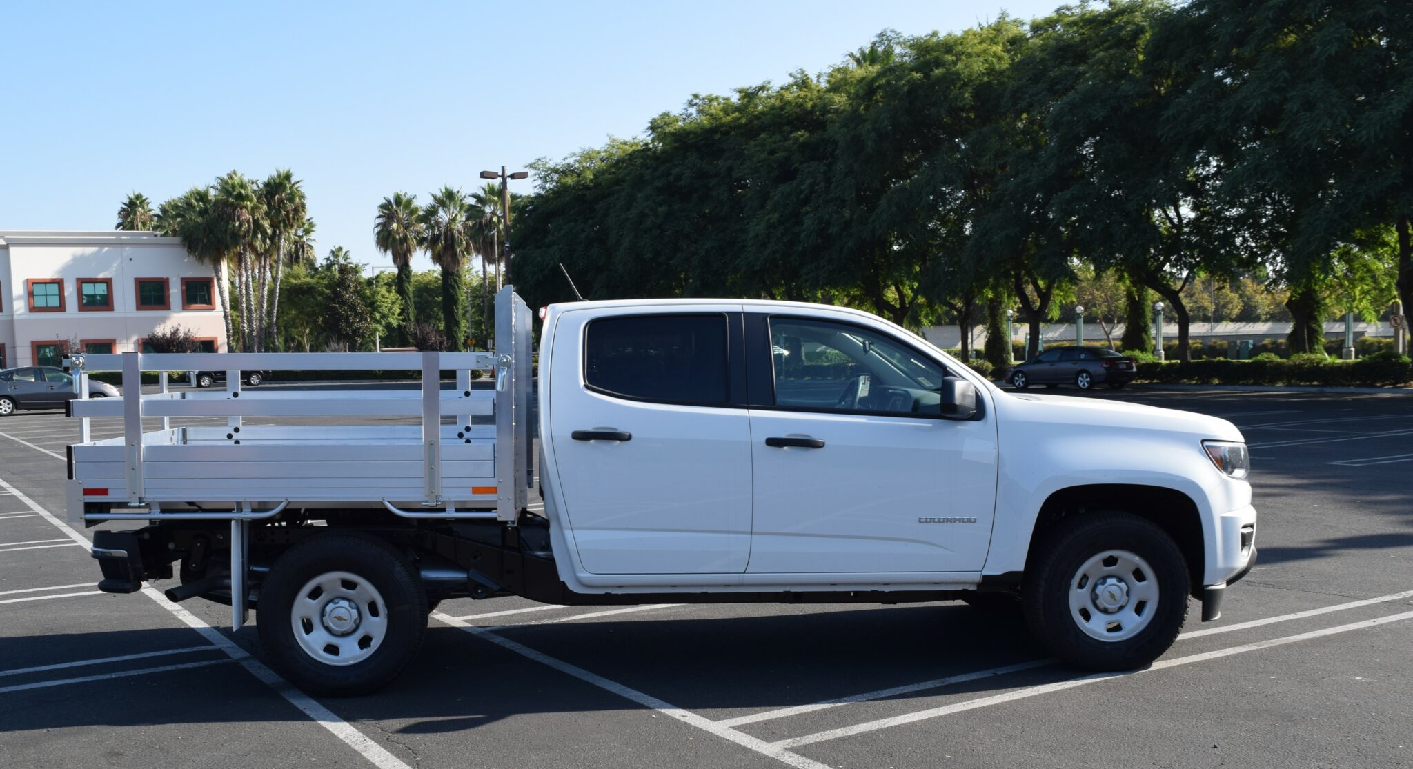 2019 Chevy Colorado 6 X 66 Aluminum Stake Bed with 22 Fold Down Gates using the Factory Bumper Side View