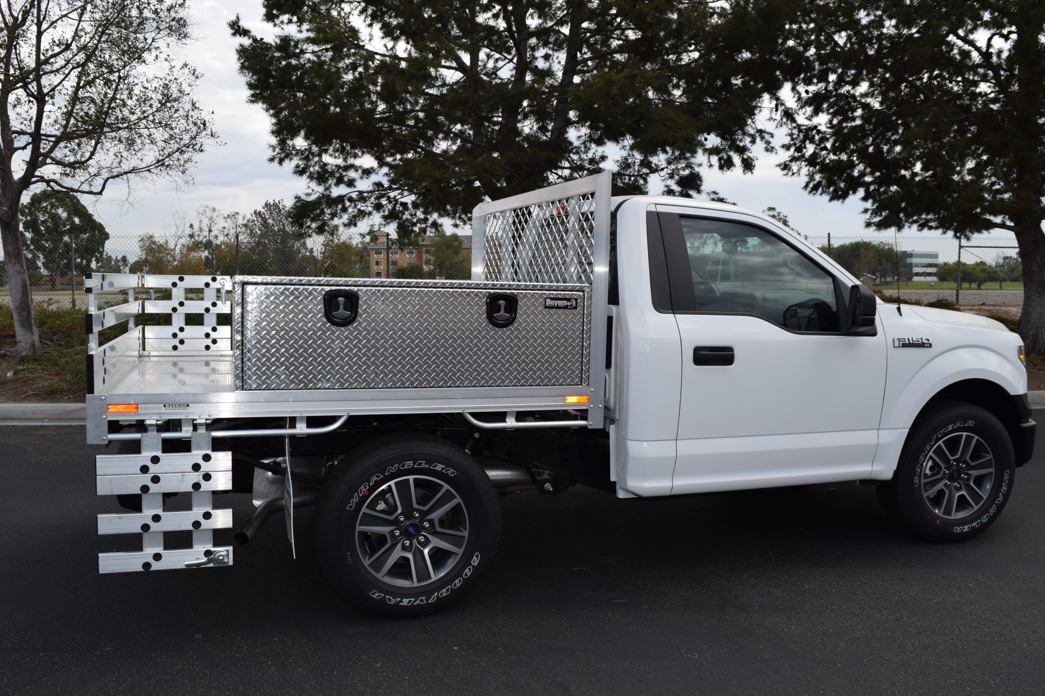 Ford F150 with a 6’6” X 7’ AlumBody aluminum flat bed with 2 topsider tool boxes 18” X 18” X 60”, and 18” fold down gates