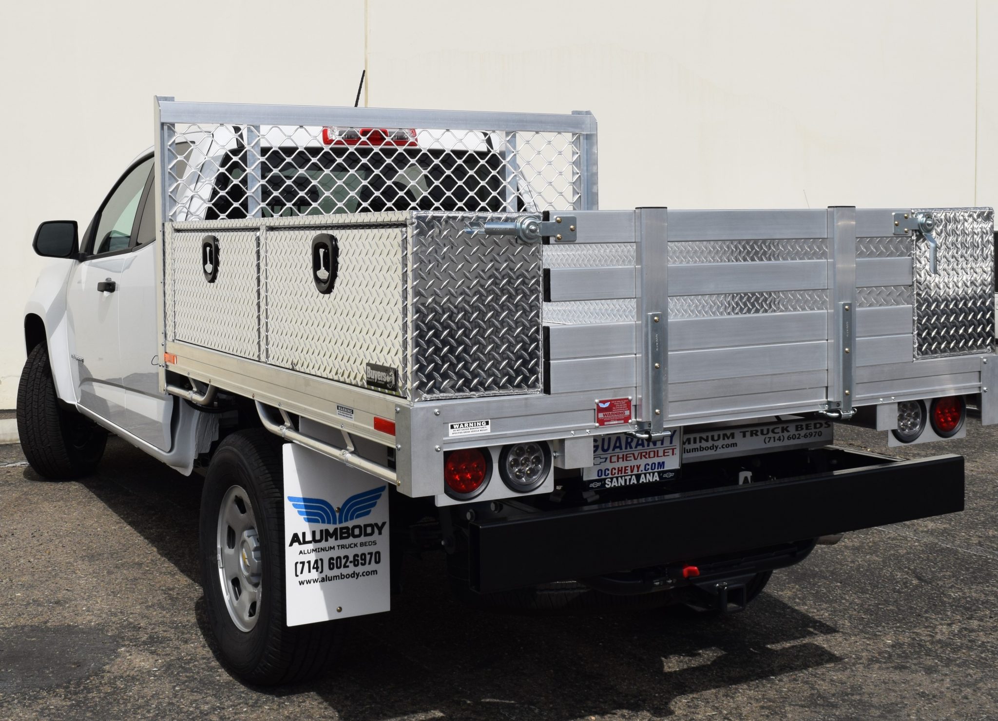 Chevy Colorado with a 6’ X 6’6” AlumBody aluminum flat bed, 2 topsider tool boxes 16” X 13” X 72”, 16” fold down rear gate, and dock bumper