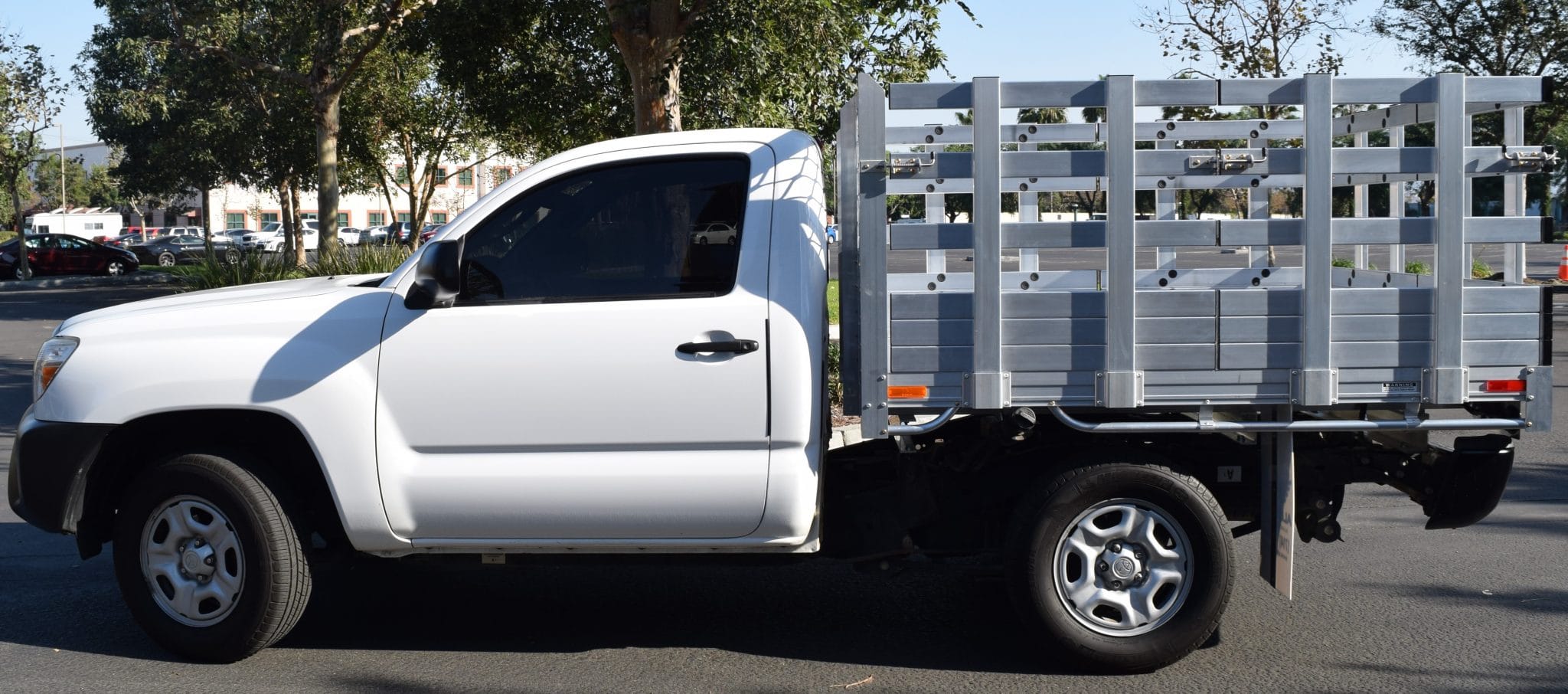 2017 Toyota Tundra with a 6'6" X 7'6" AlumBody aluminum stake bed, 38" lift-out stakes and dock bumper