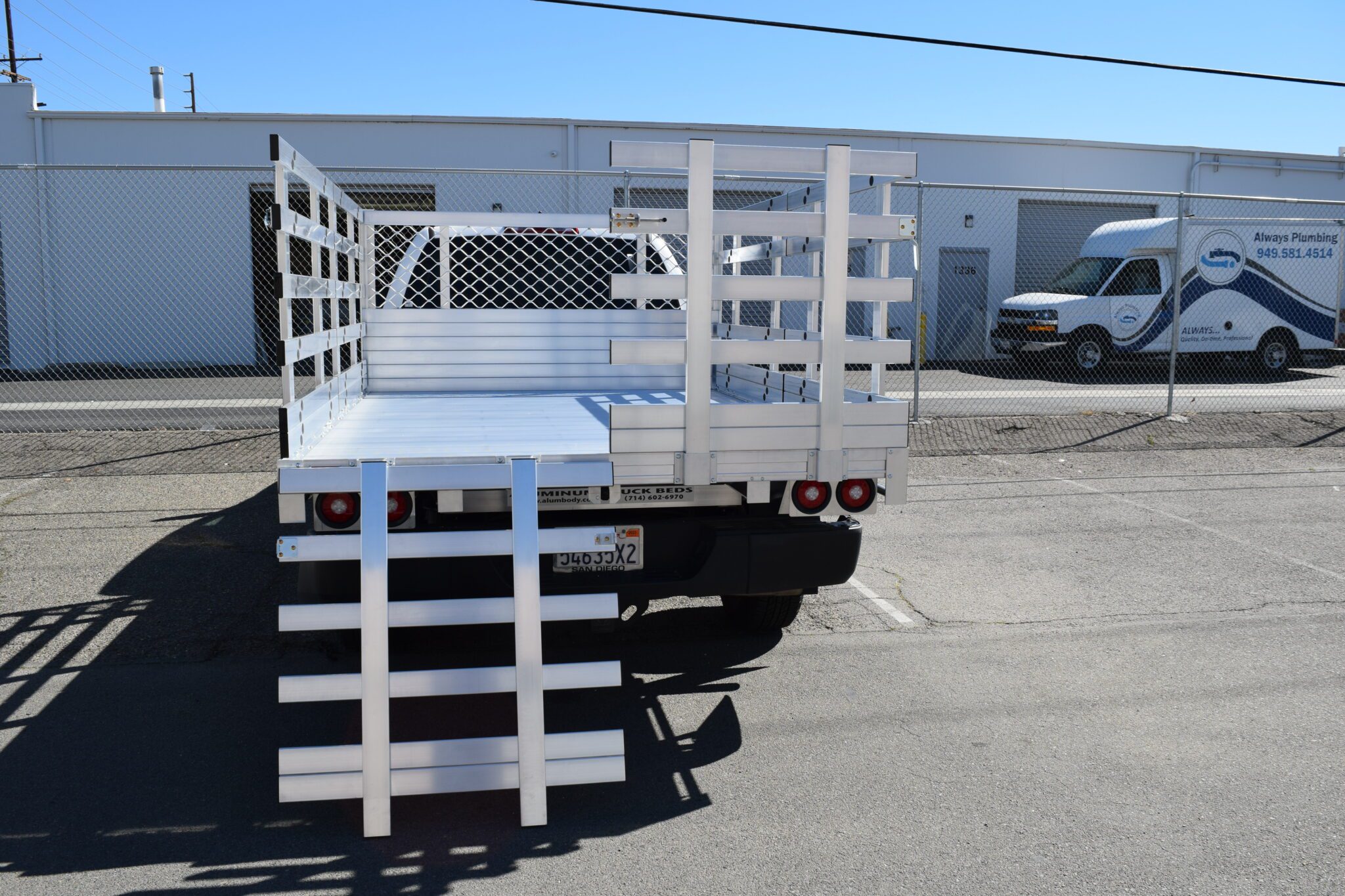 2020 Toyota Tundra, 6'6" x 9' aluminum stake bed with 38" lift-out gates, using the factory bumper