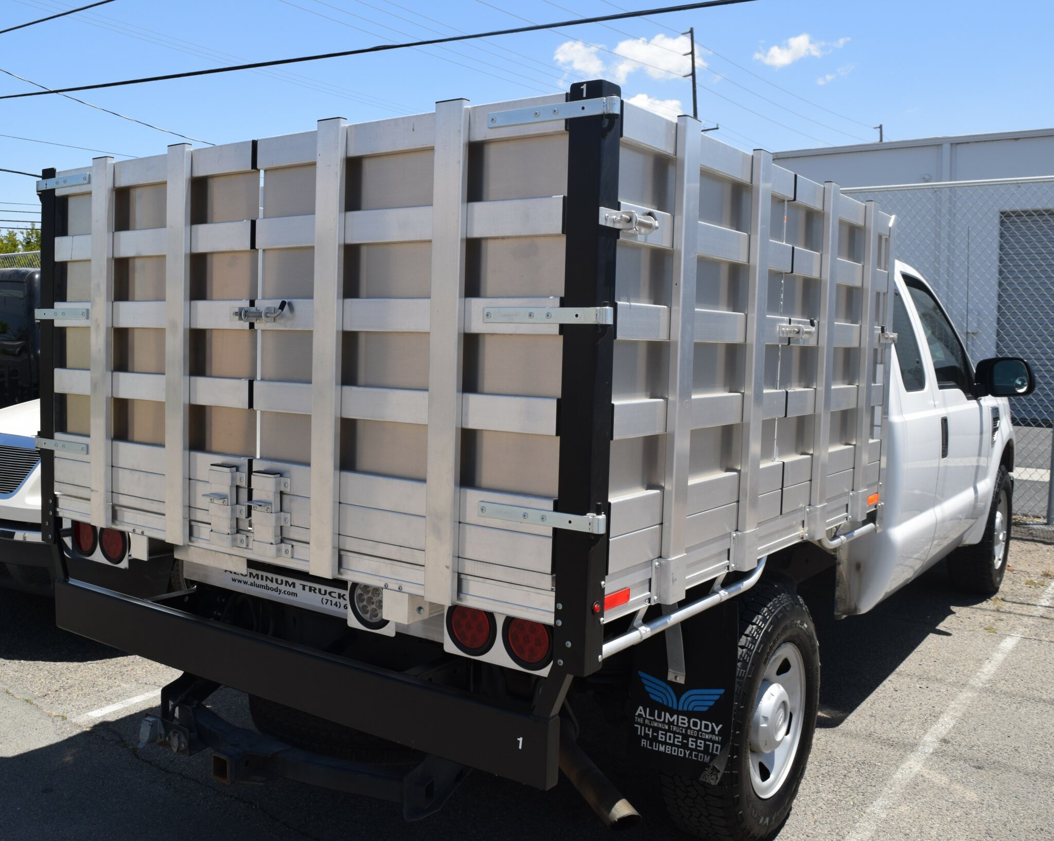 2014 F250 with a 66" × 7' Aluminum Bed with 38" solid barn doors, hitch and dock bumper