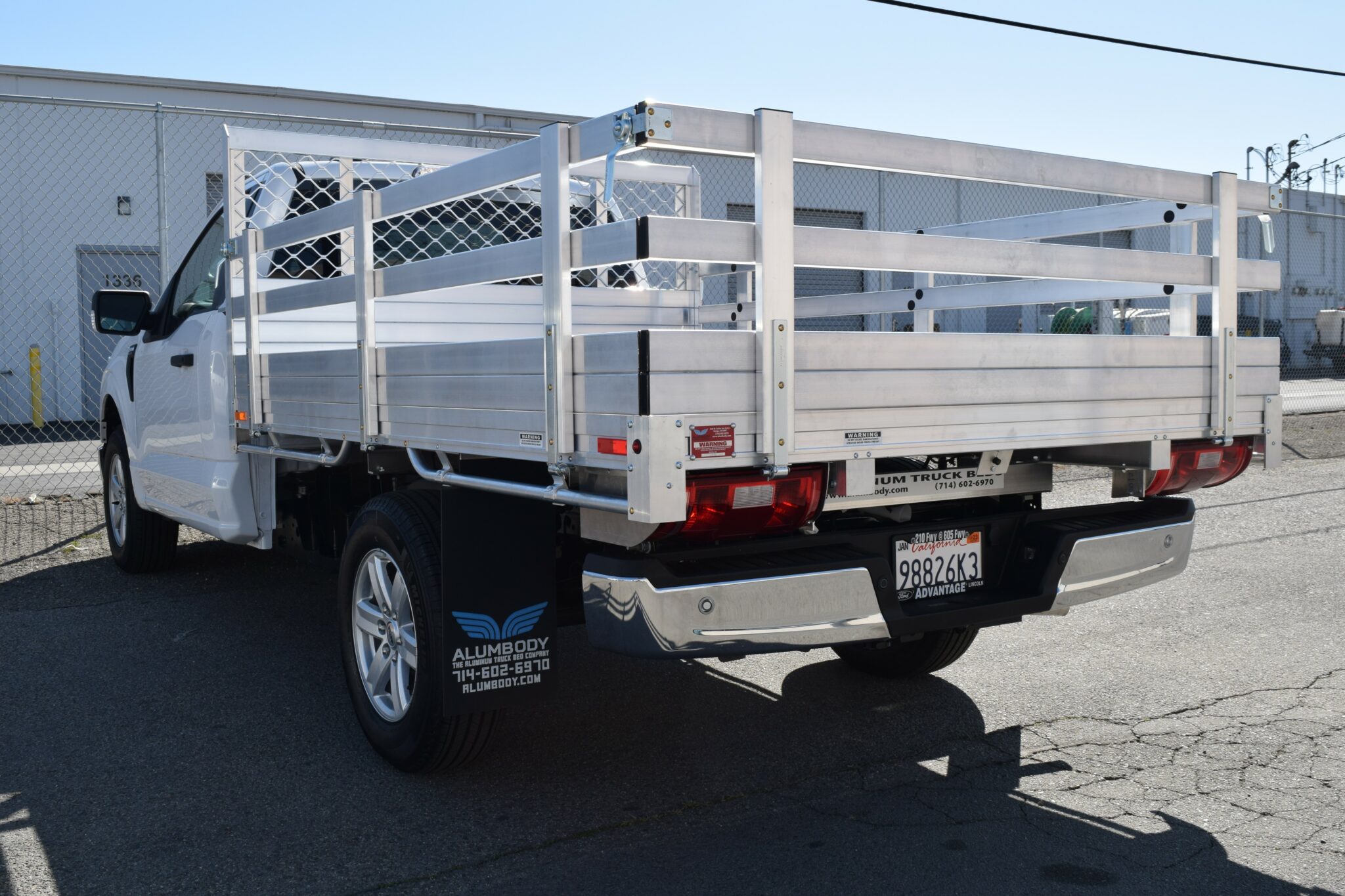 2021 F150 with a 66" × 9' AlumBody aluminum bed, 22" fold-down gates using the factory taillights and factory bumper