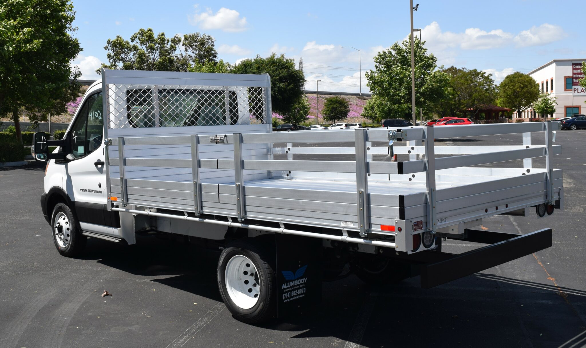 2019 Ford Transit 76x12 aluminum flatbed with 22 fold down gates and dock bumper