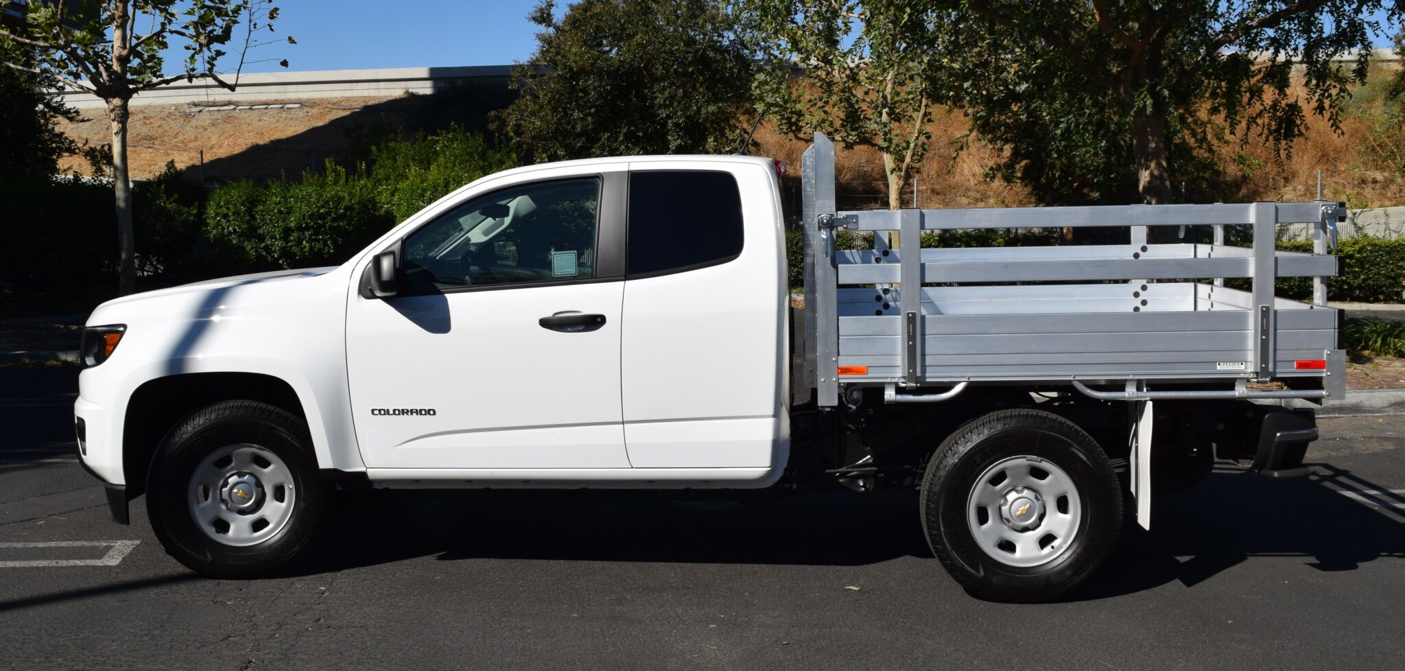 2017 Chevy Colorado 6 X 66 with an aluminum flat bed 22 fold down gates using the factory bumper. Showing drivers side.