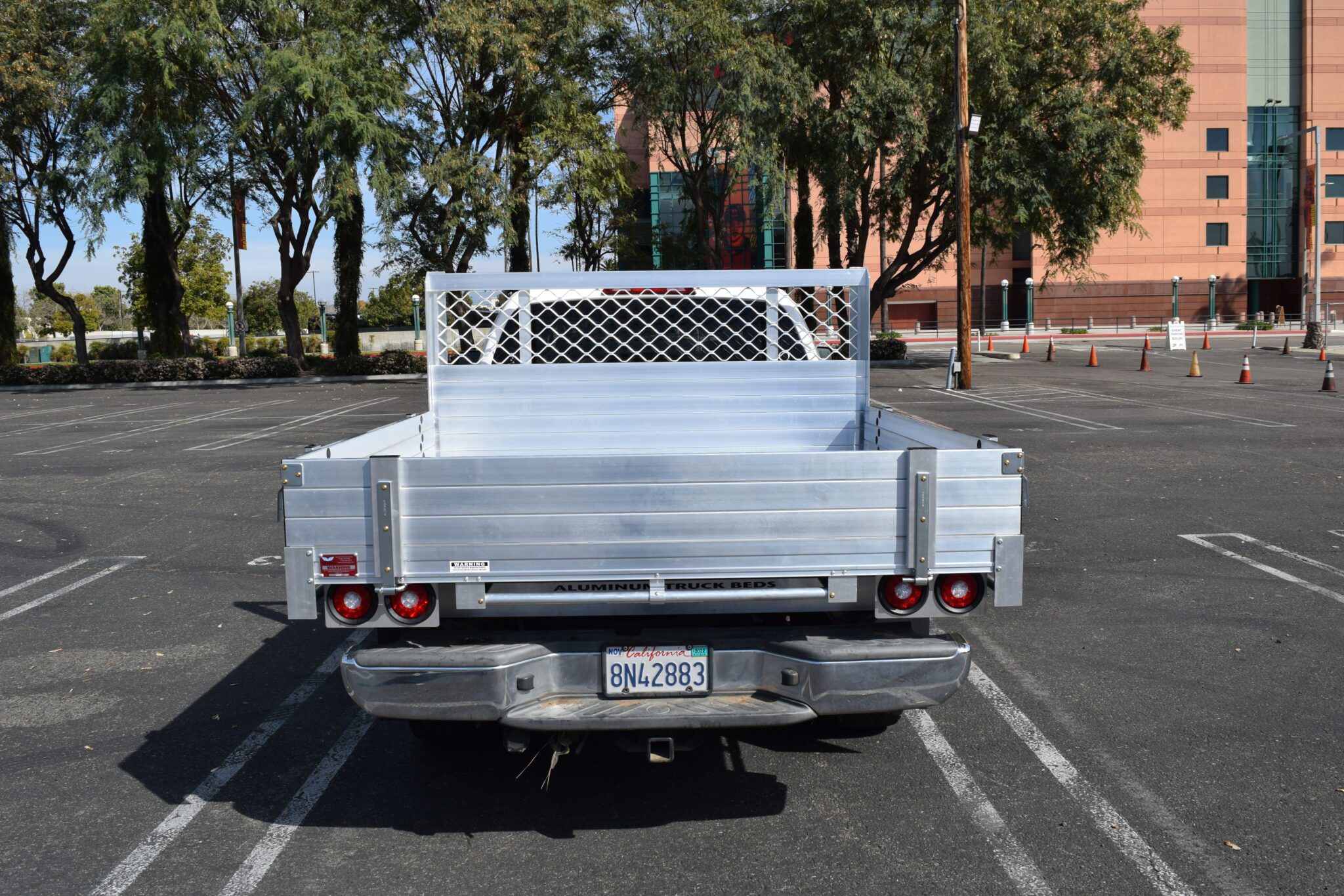 2008 Nissan Frontier with a 66×66 aluminum body with 9" solid fold-down gates, rear rope rail using the factory bumper