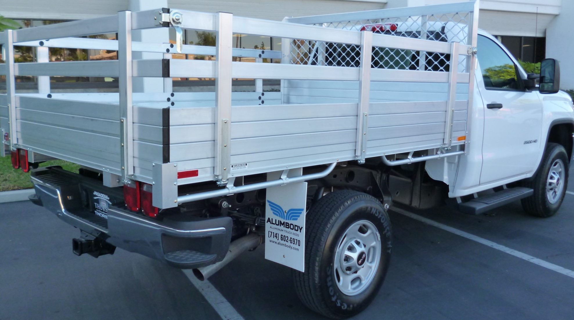 2015 GMC 2500 6'6''x9' aluminum flat bed with 25'' fold down gates using the factory bumper