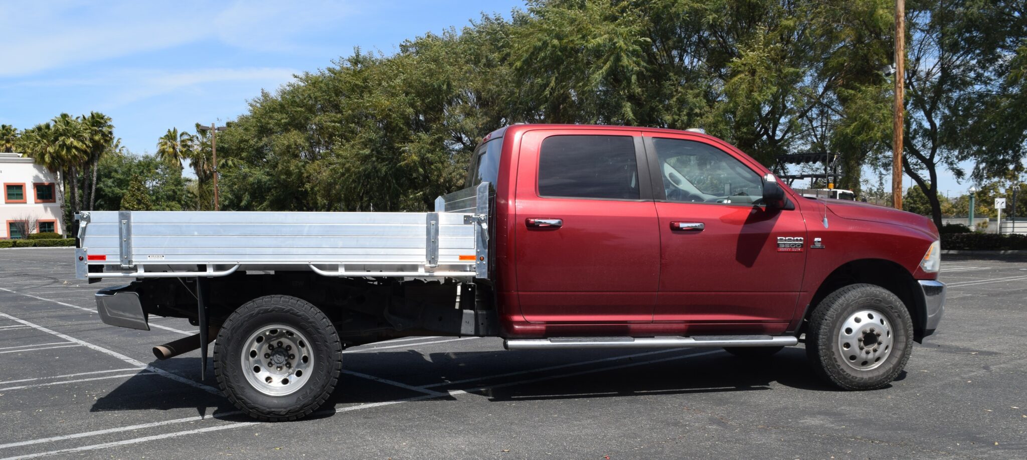 2012 Ram 3500 aluminum flatbed 8'x9' with 9'' solid fold down gates and a no mesh headboard