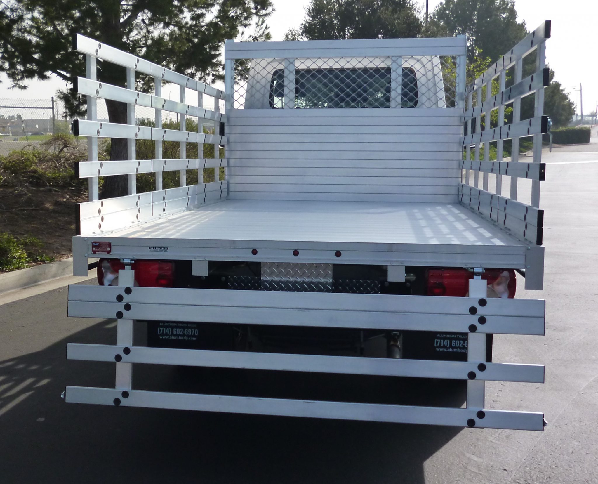 2017 Mercedes-Benz Sprinter 3500 DRW with a 7' X 12' AlumBody aluminum flat bed with 22" fold down gates and dock bumper