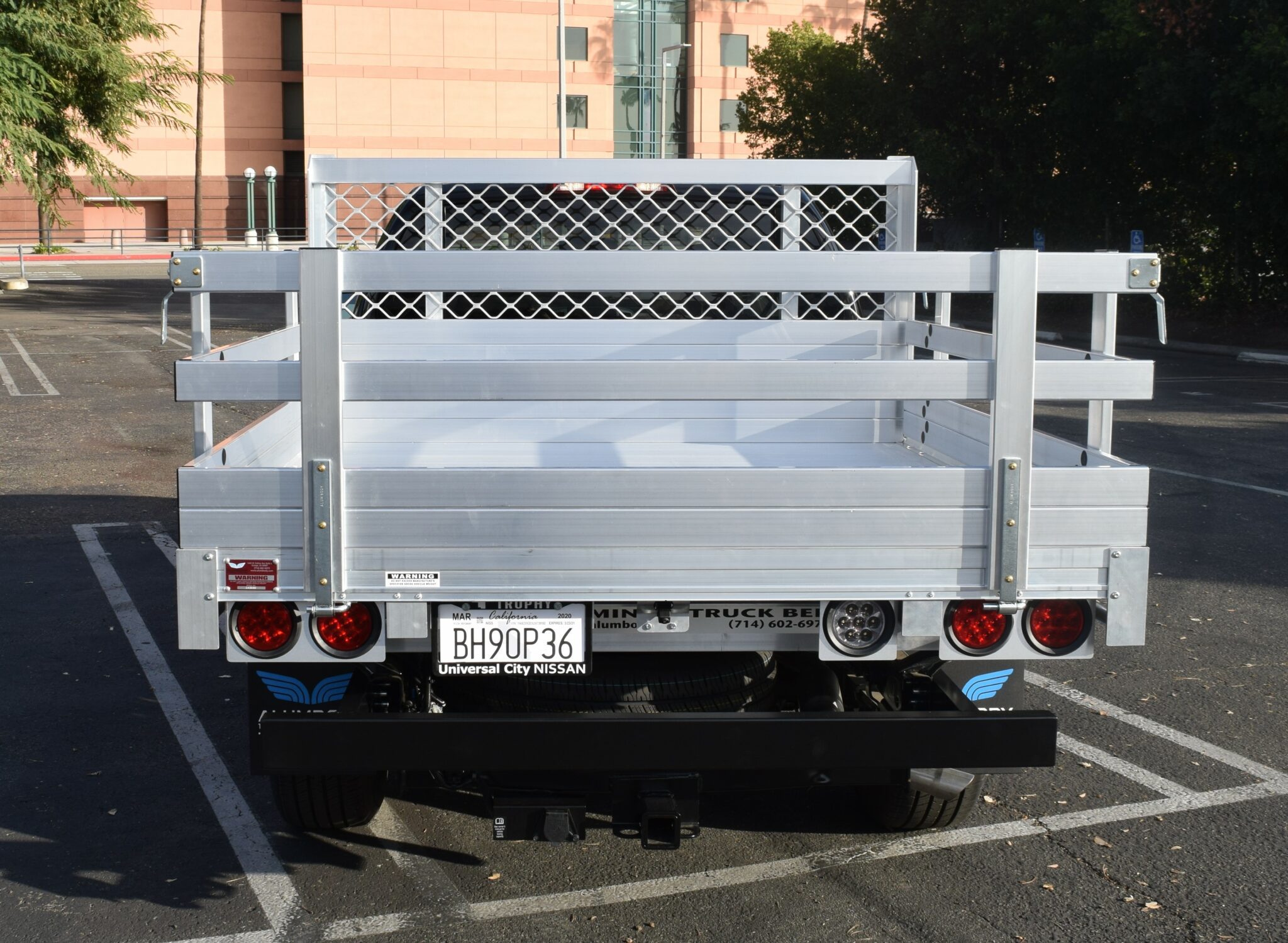 2020 Nissan Frontier 6'x6'6'' aluminum flatbed, 22'' fold down gates with a dock bumper and hitch